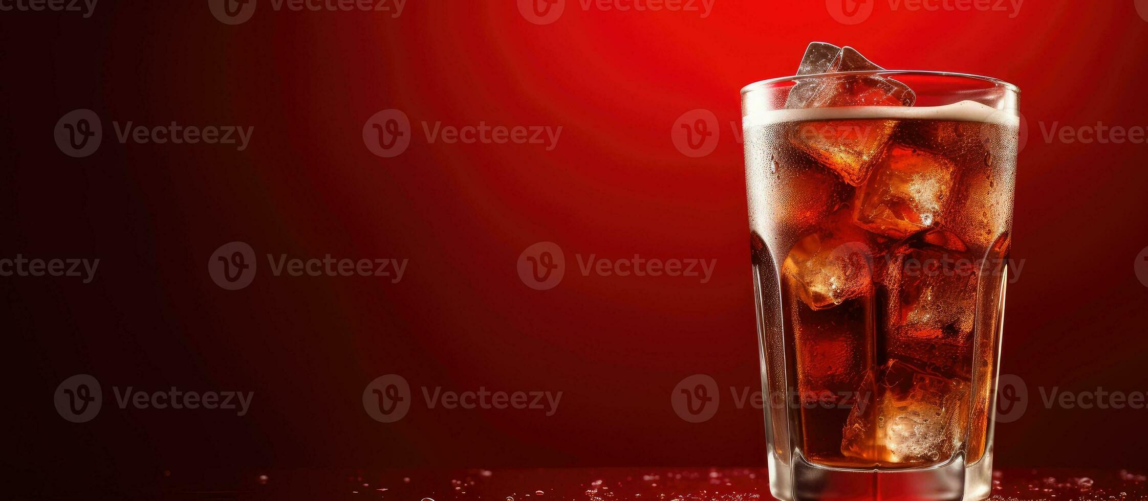 A glass of cola with ice, against a red background, provides a refreshing beverage option. With photo