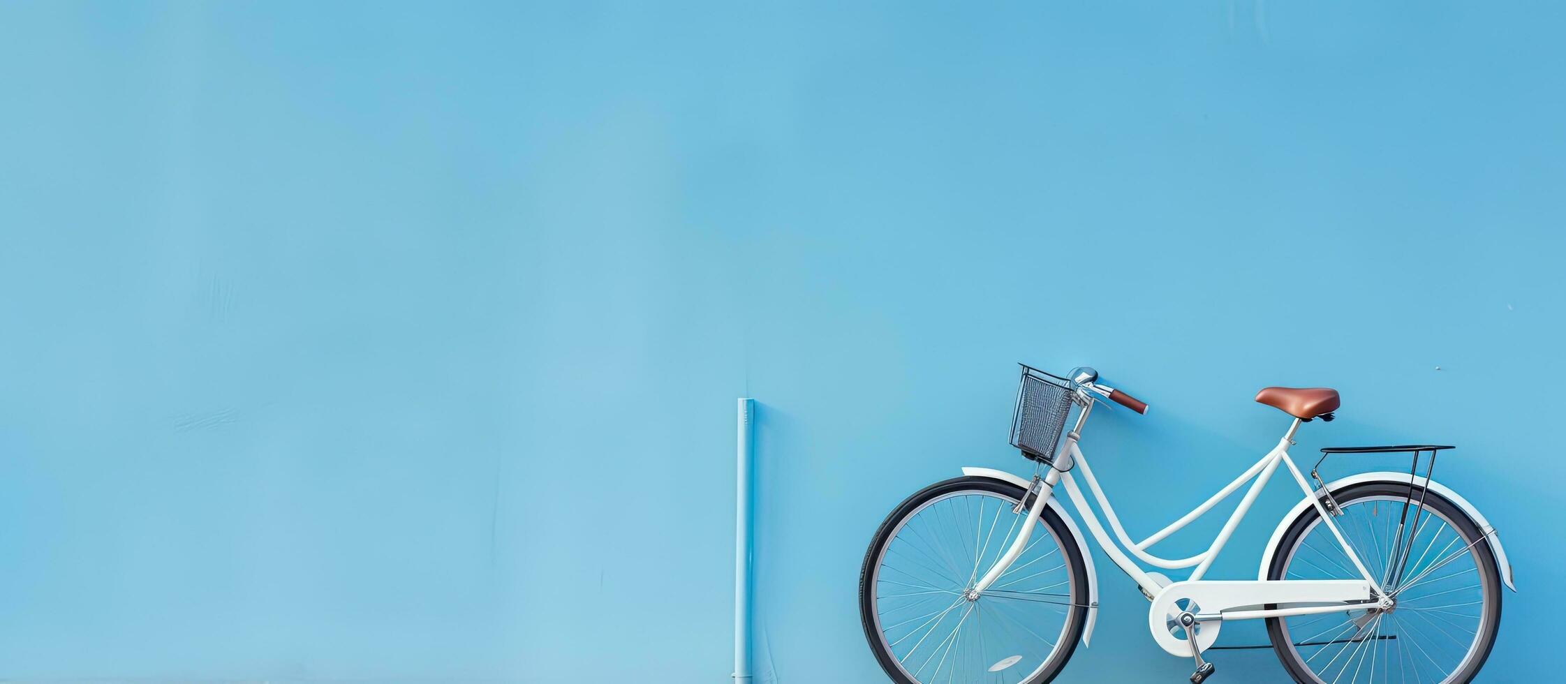un alta calidad foto de un bicicleta es posicionado en contra un azul muro, con vacío espacio disponible
