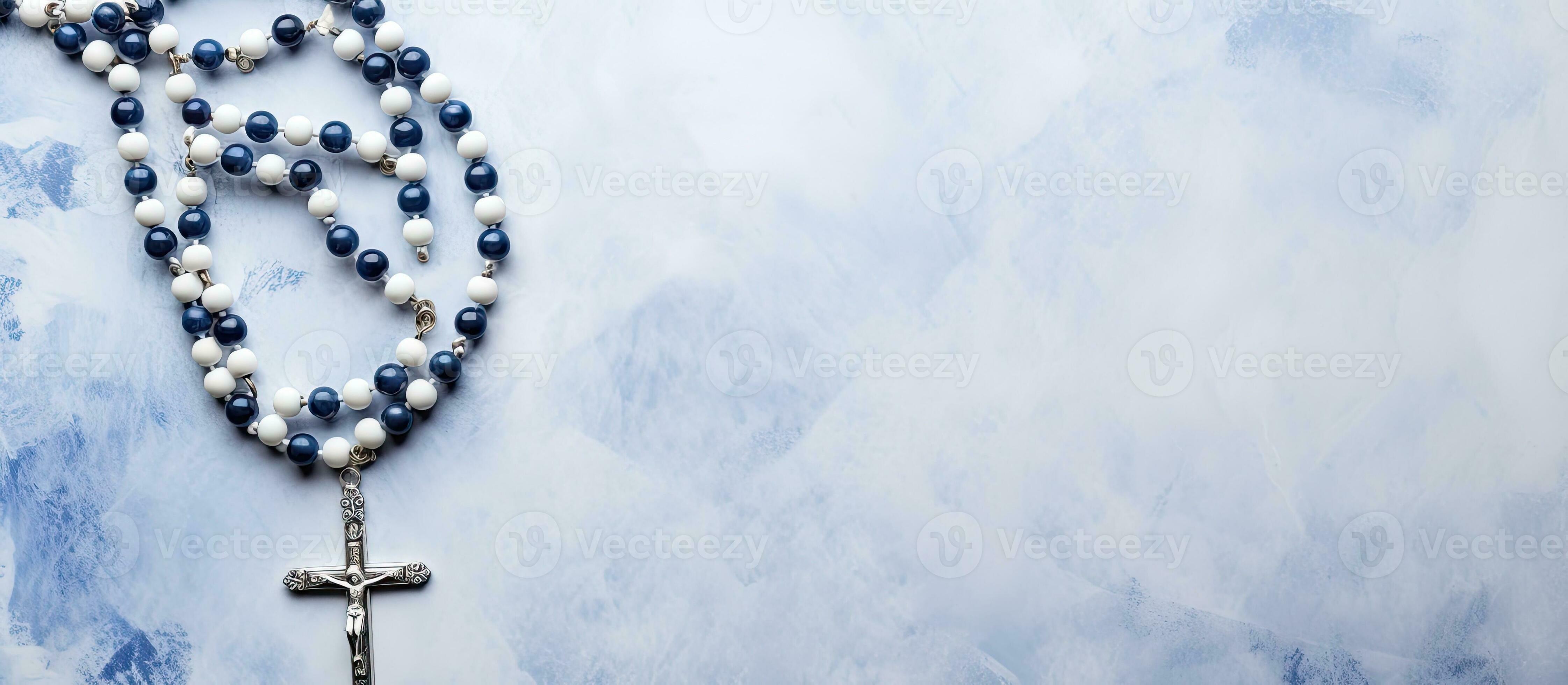 A white canvas with a painted background displaying a blue-beaded