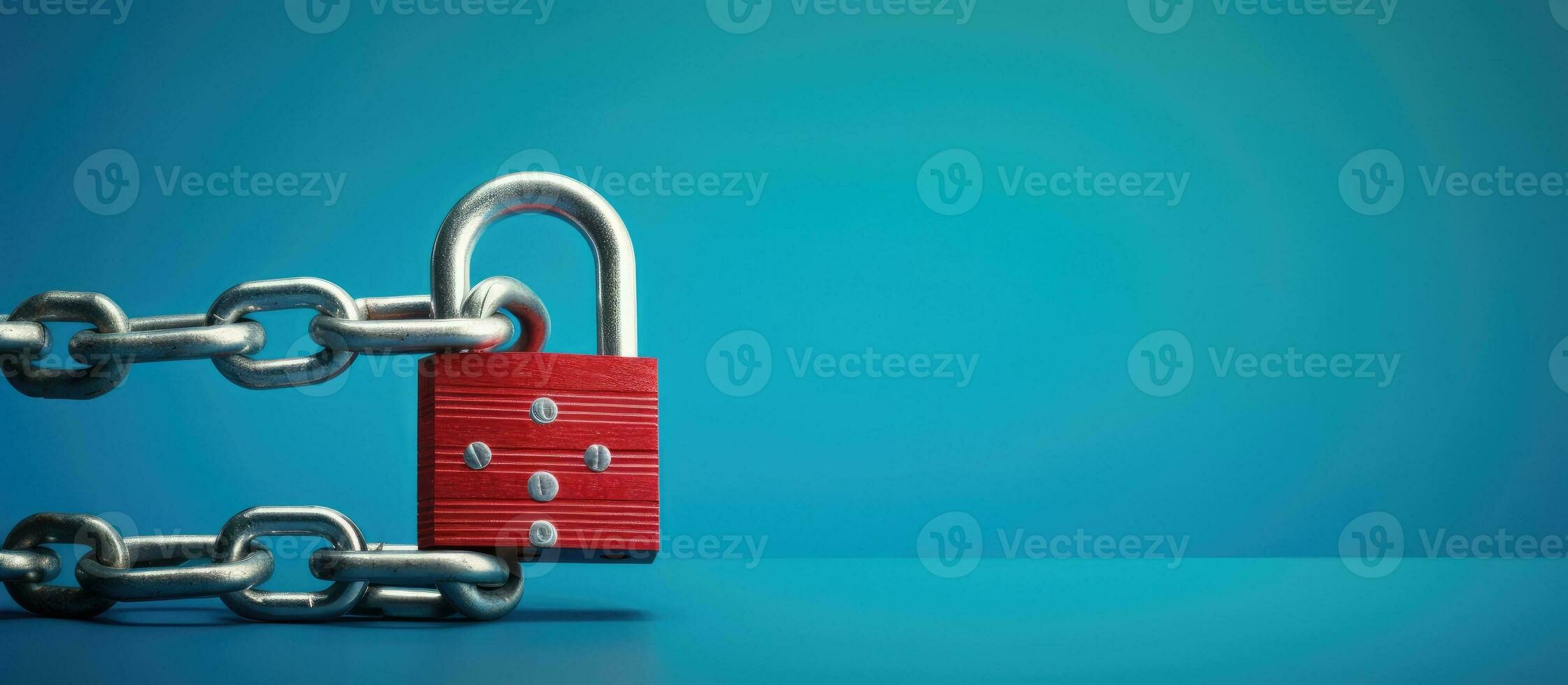 Safety Concept A red chain and padlock on a blue background symbolize safety. photo