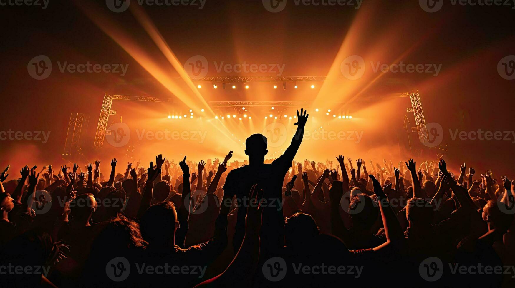 Audience raising hands enjoying live music festival concert rock band performing on outdoor stage in spotlight photo