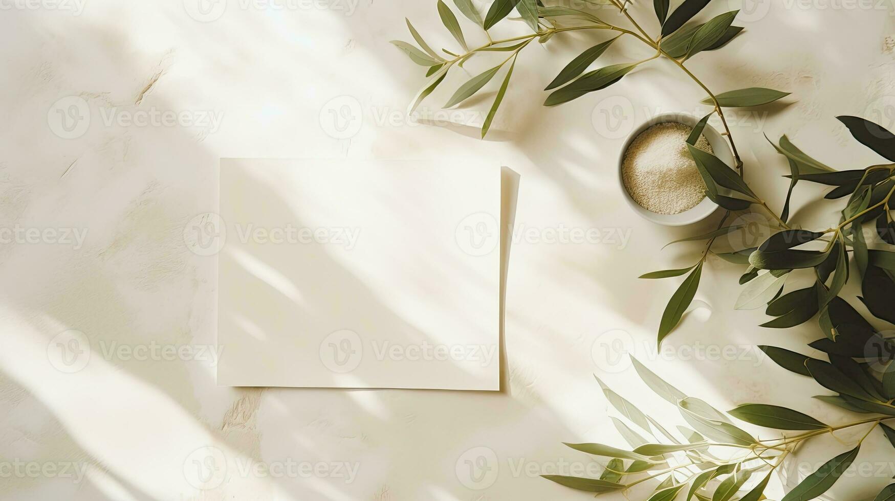 Summer wedding stationery mock up scene with a blank greeting card wooden plate and olive tree leaves and branches in sunlight White table background with palm shadows Femi photo