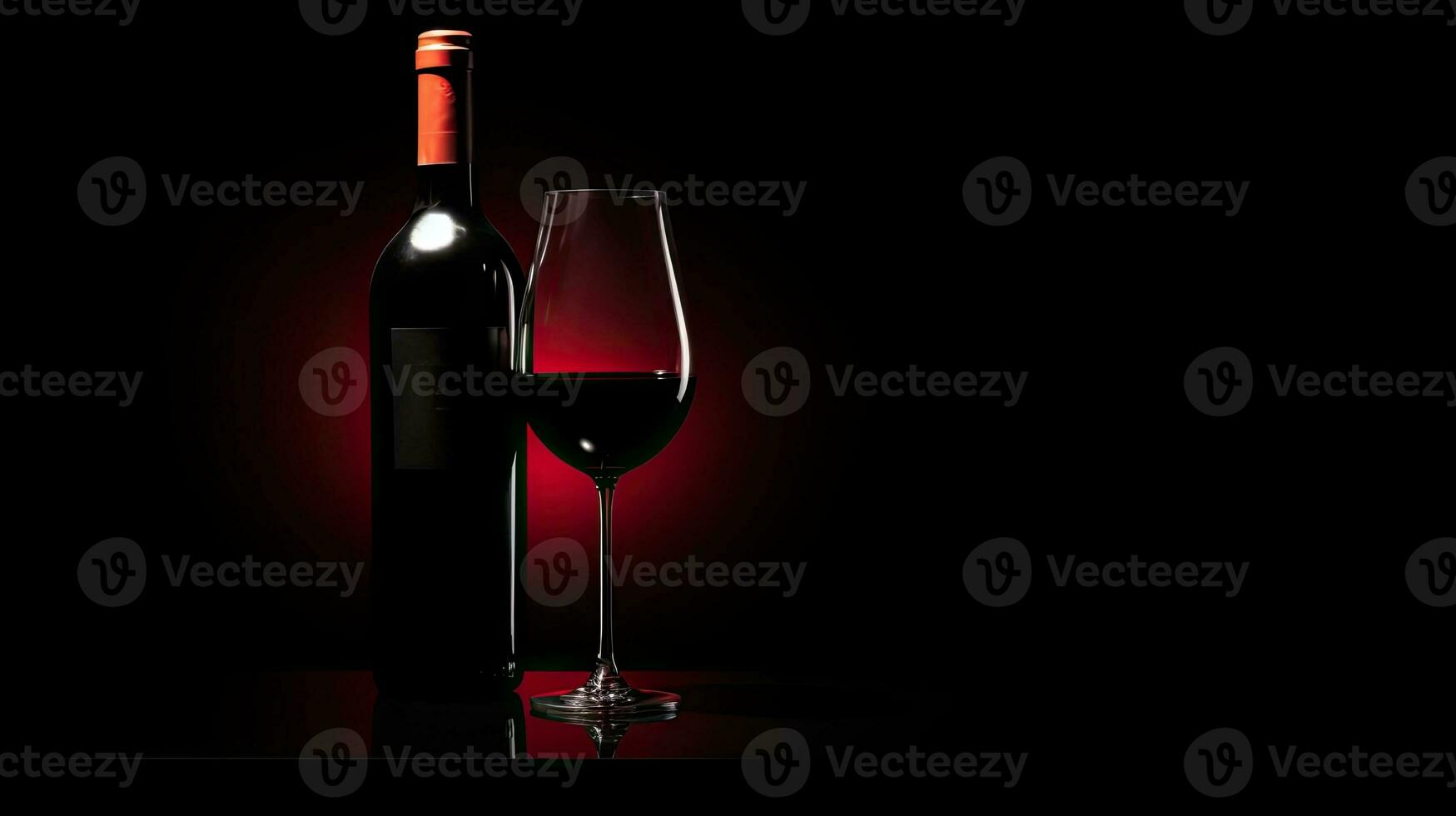 Red wine bottle and glass black background photo