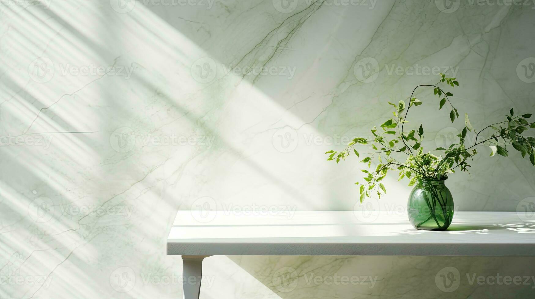 Green branch of tree with shadow against white marble tile wall and wood table with copy space in the spring sunlight photo