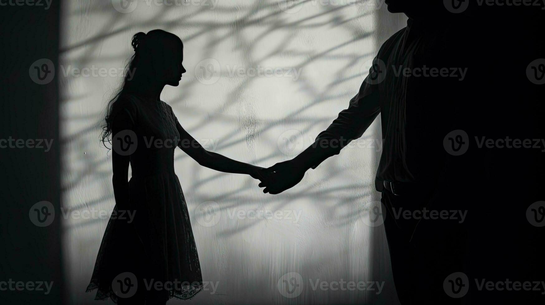 Silhouetted couple s hands monochrome with vignette photo