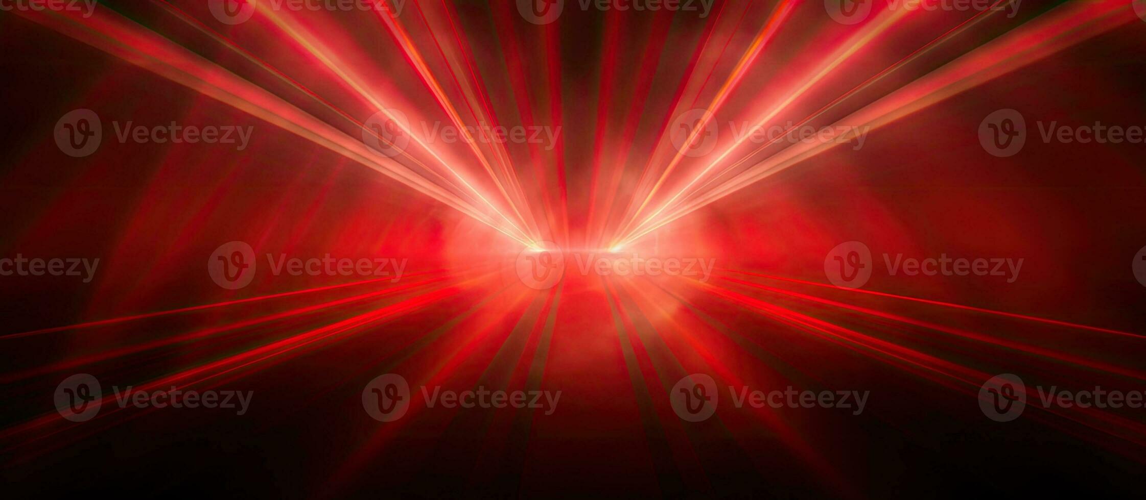 Spotlight beams on red backdrop photo