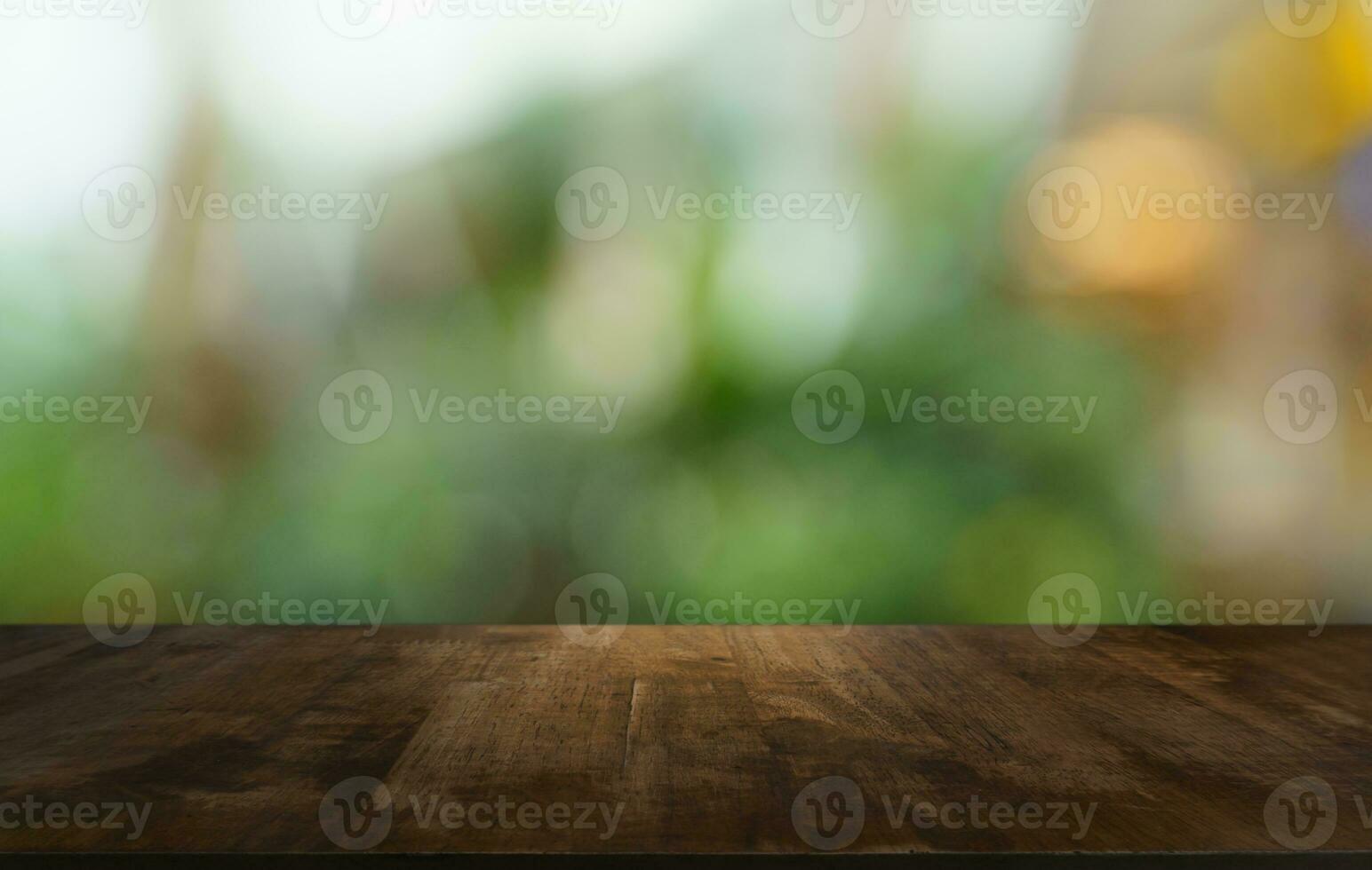 Empty wood table top and blur of out door garden background Empty wooden table space for text marketing promotion. blank wood table copy space for background photo