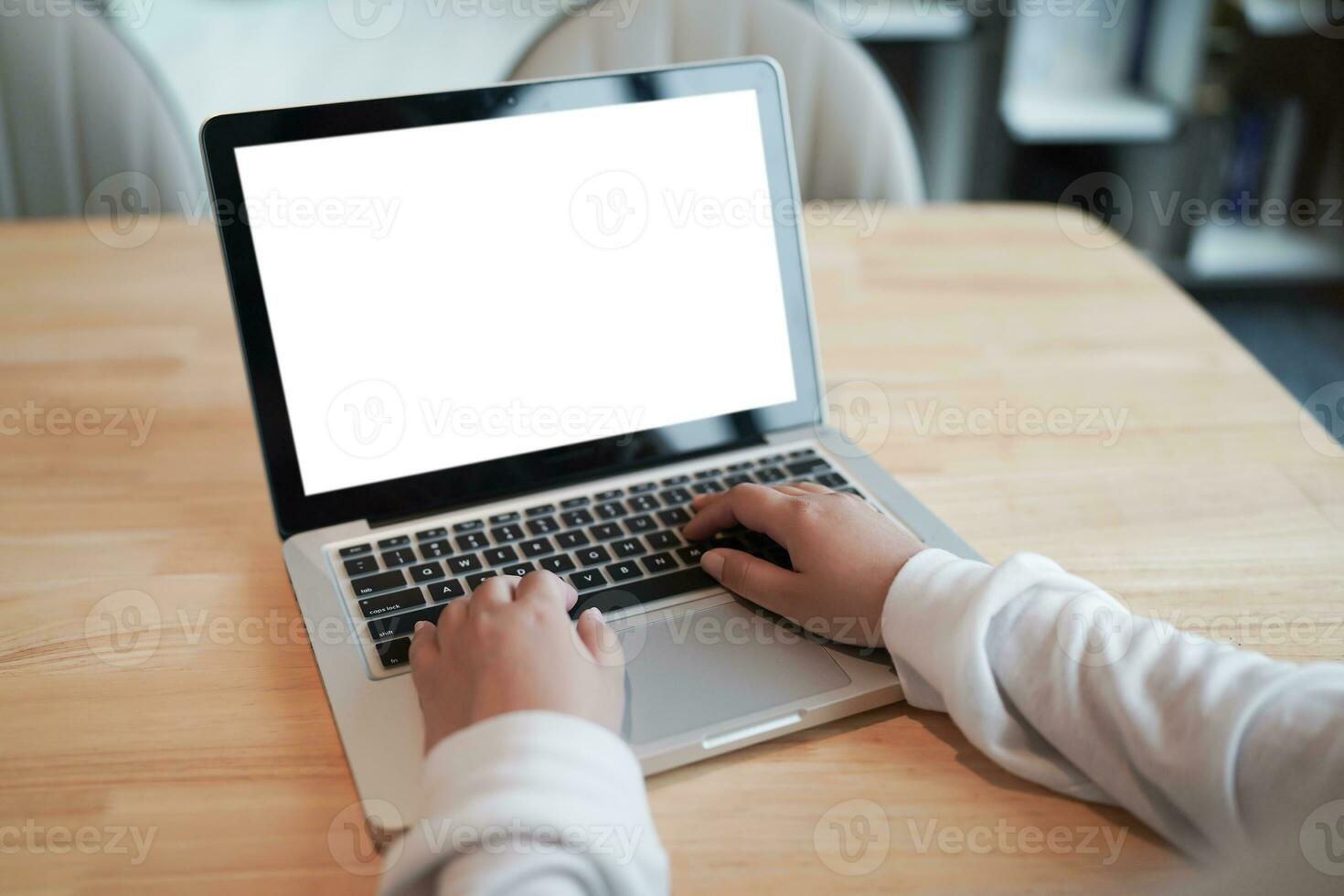 Woman Working by using laptop blank screen computer . Hands typing on a keyboard.technology e-commerce concept. photo