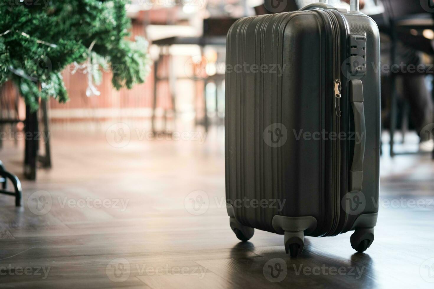 Large suitcases stand in the lobby of the hotel on the background. photo
