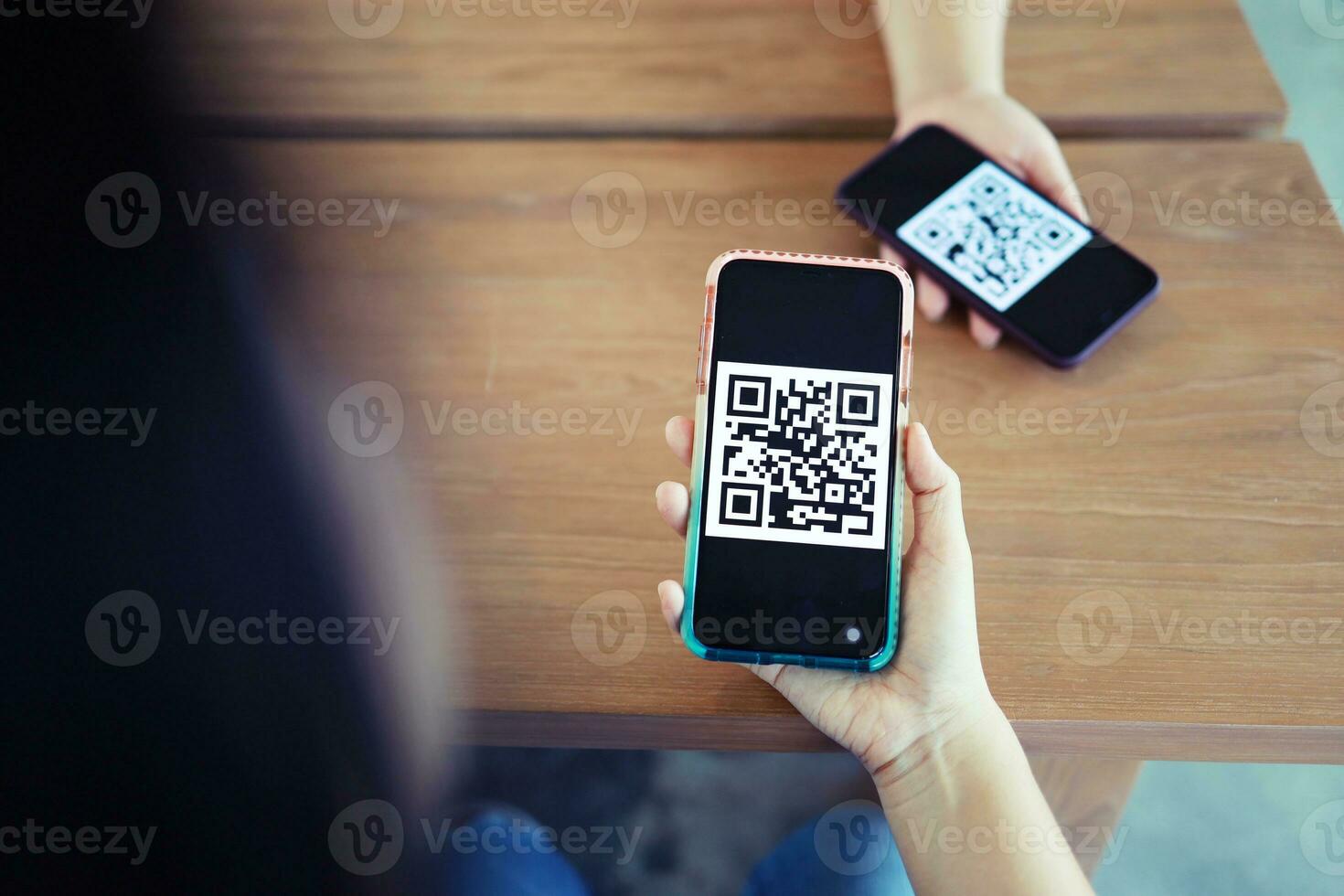 Qr code payment. Woman scanning QR code online shopping cashless technology concept. photo