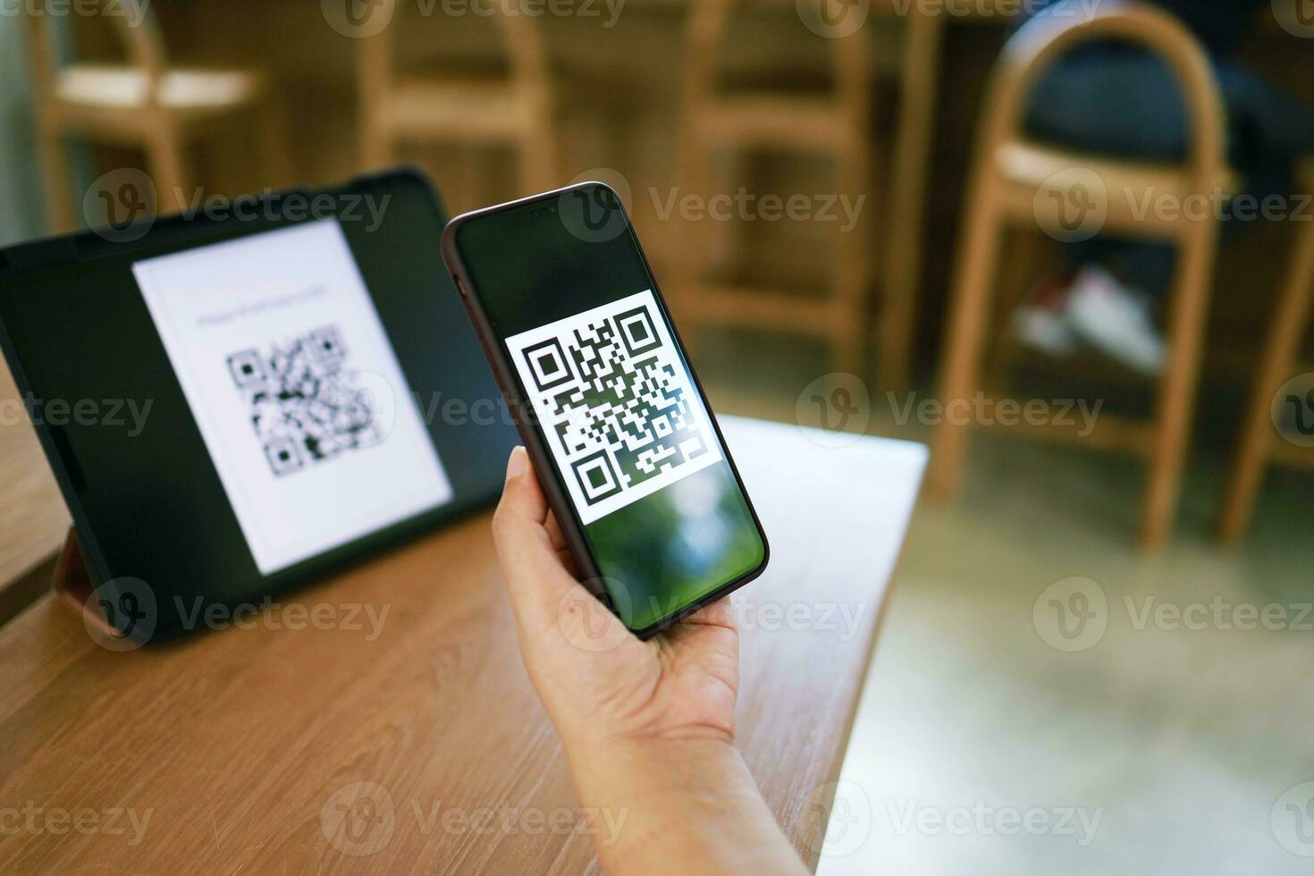 Qr code payment. Woman scanning QR code online shopping cashless technology concept. photo