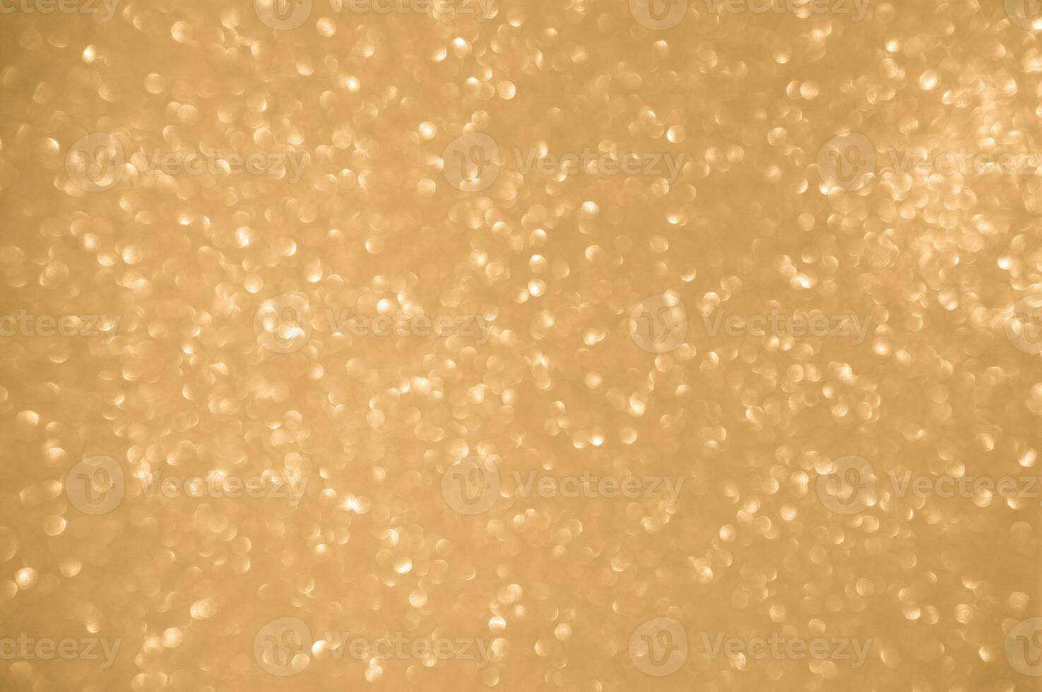 Gold glitters background. shimmering blur spot lights Bokeh Shiny gold light background. photo