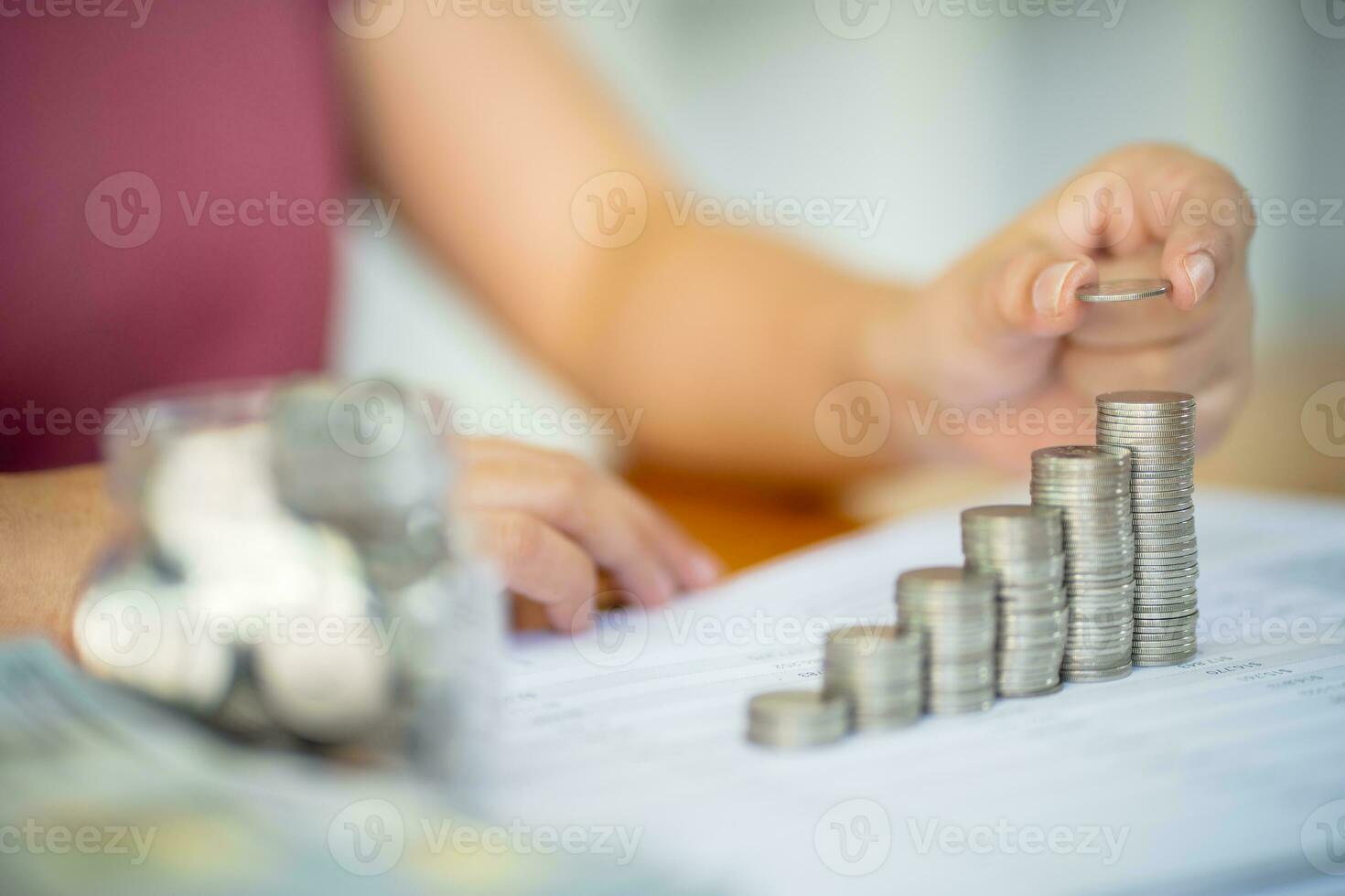 Saving money. Businessman Accountant verify growing business and saving money stacking coins with calculator. Accountancy Concept. photo