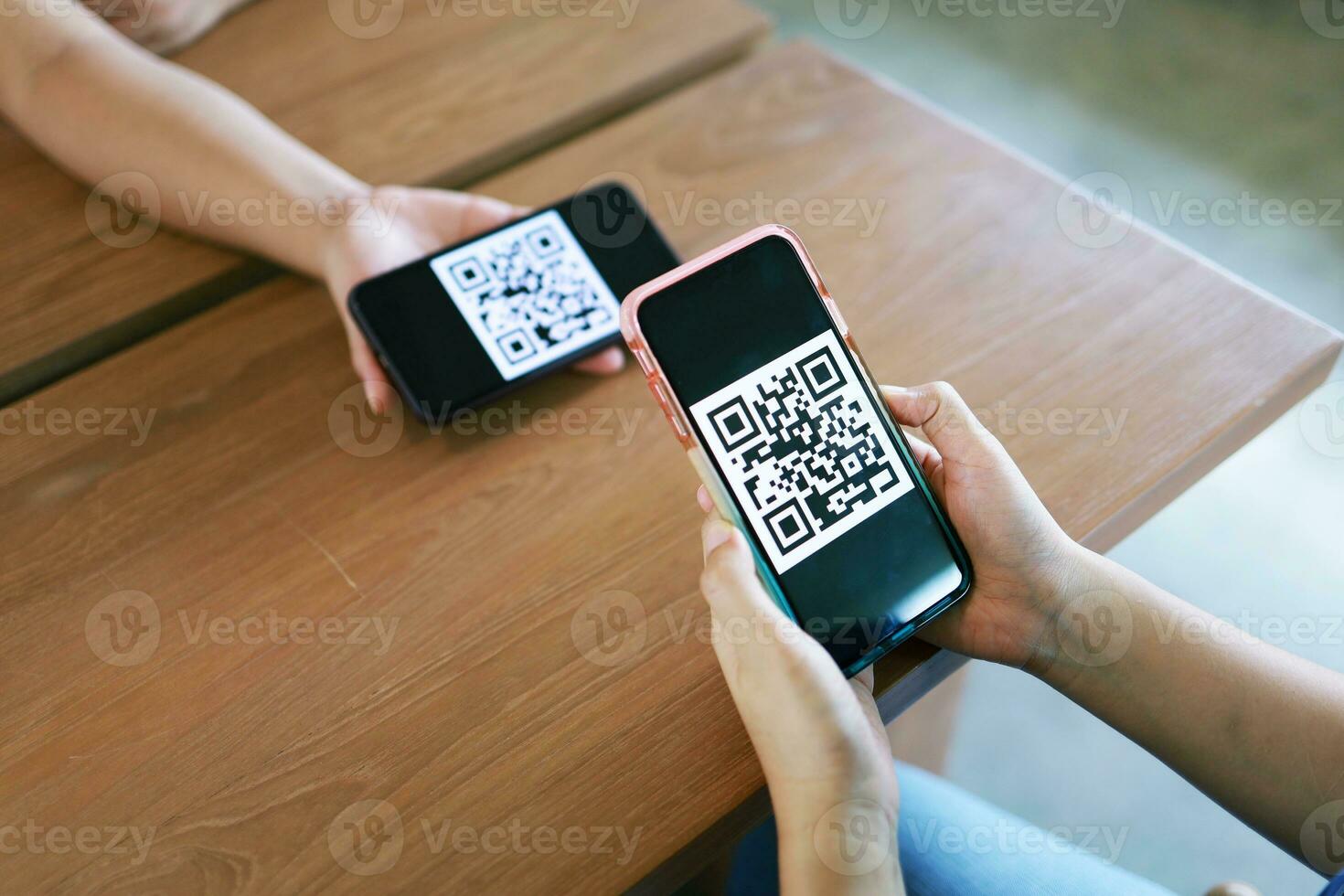Qr code payment. Woman scanning QR code online shopping cashless technology concept. photo