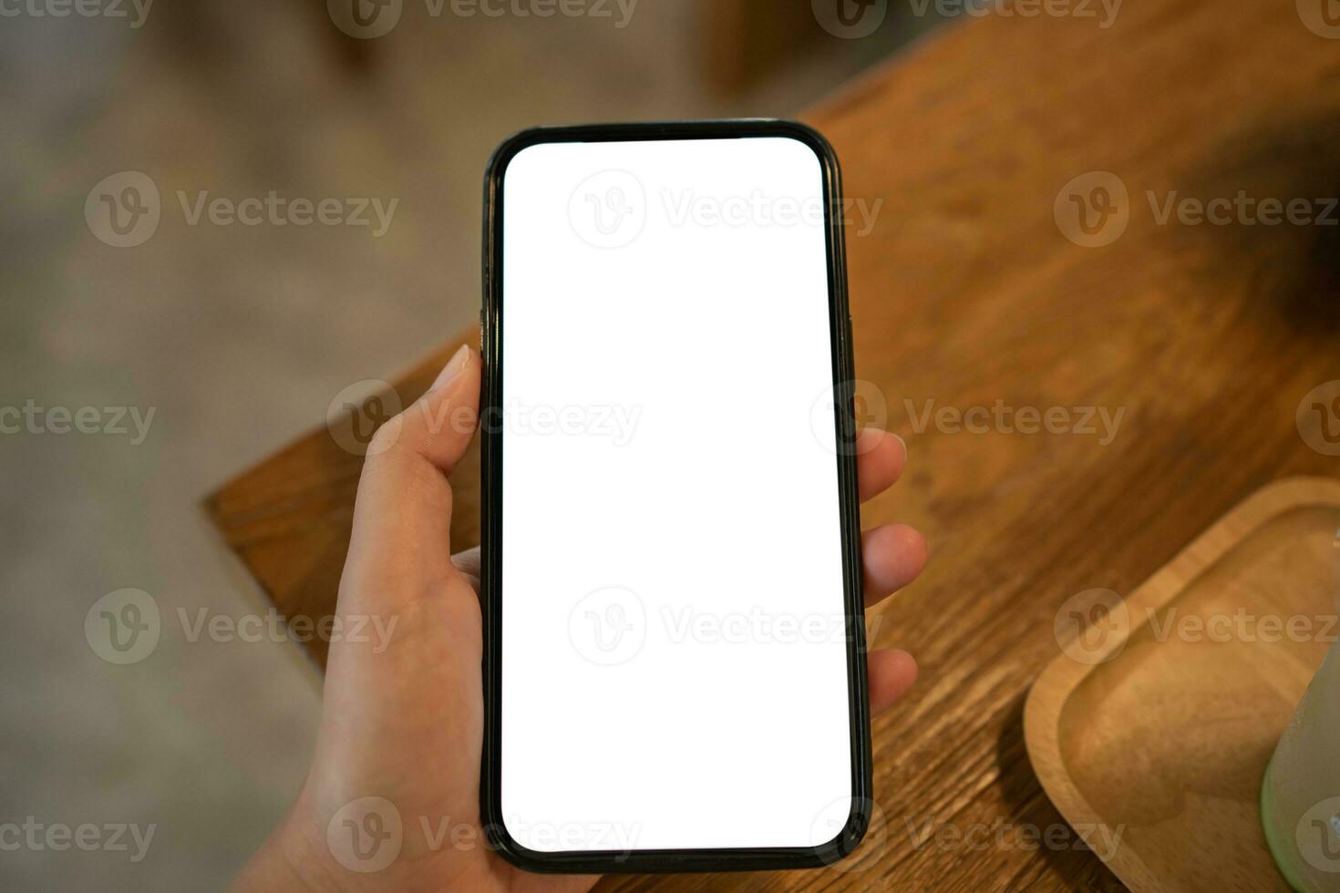 Cropped shot view of Women's hands holding cell telephone blank copy space screen. smart phone with technology concept photo