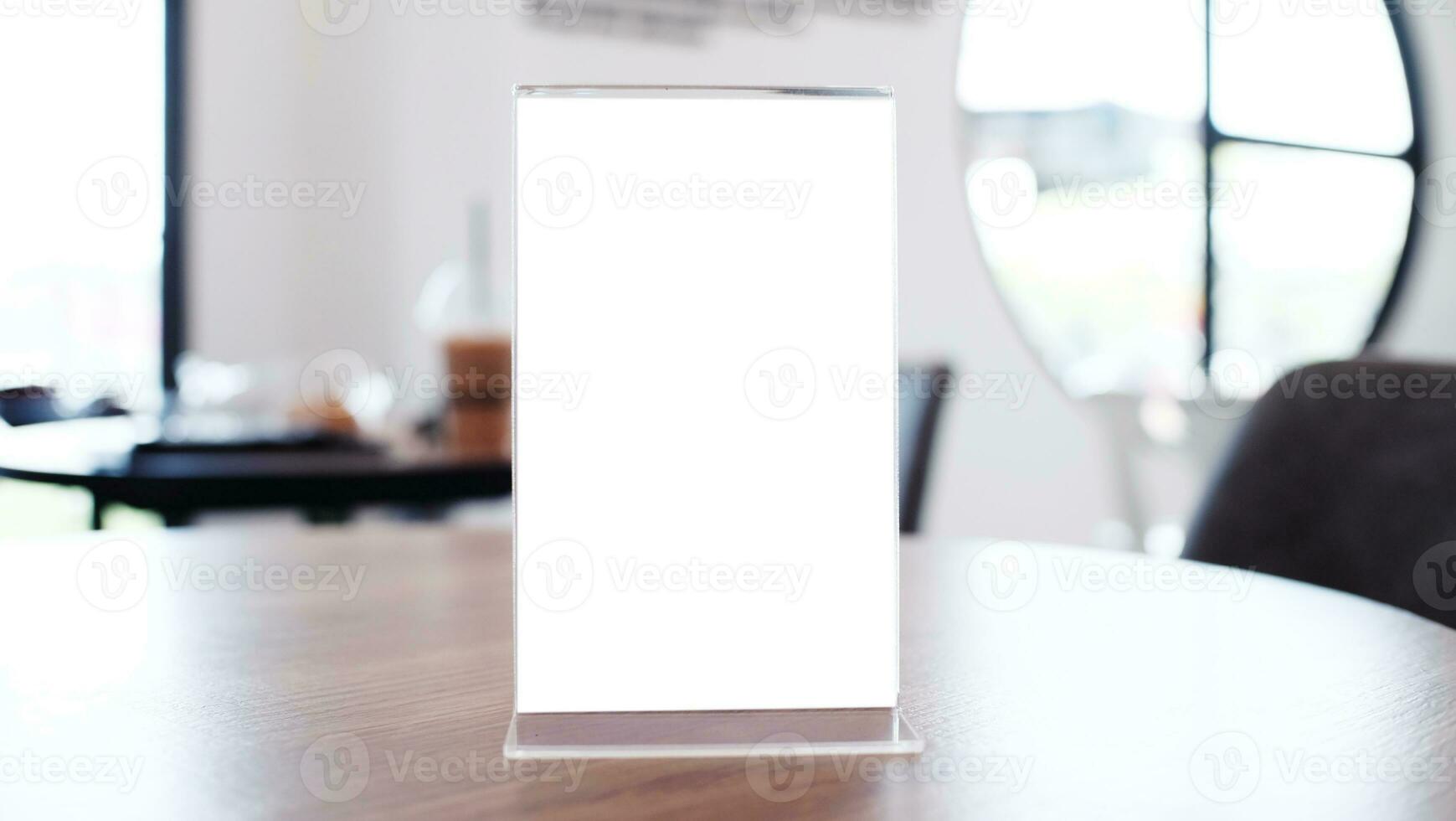 Menu frame standing on wood table in Bar restaurant cafe. space for text marketing promotion. photo