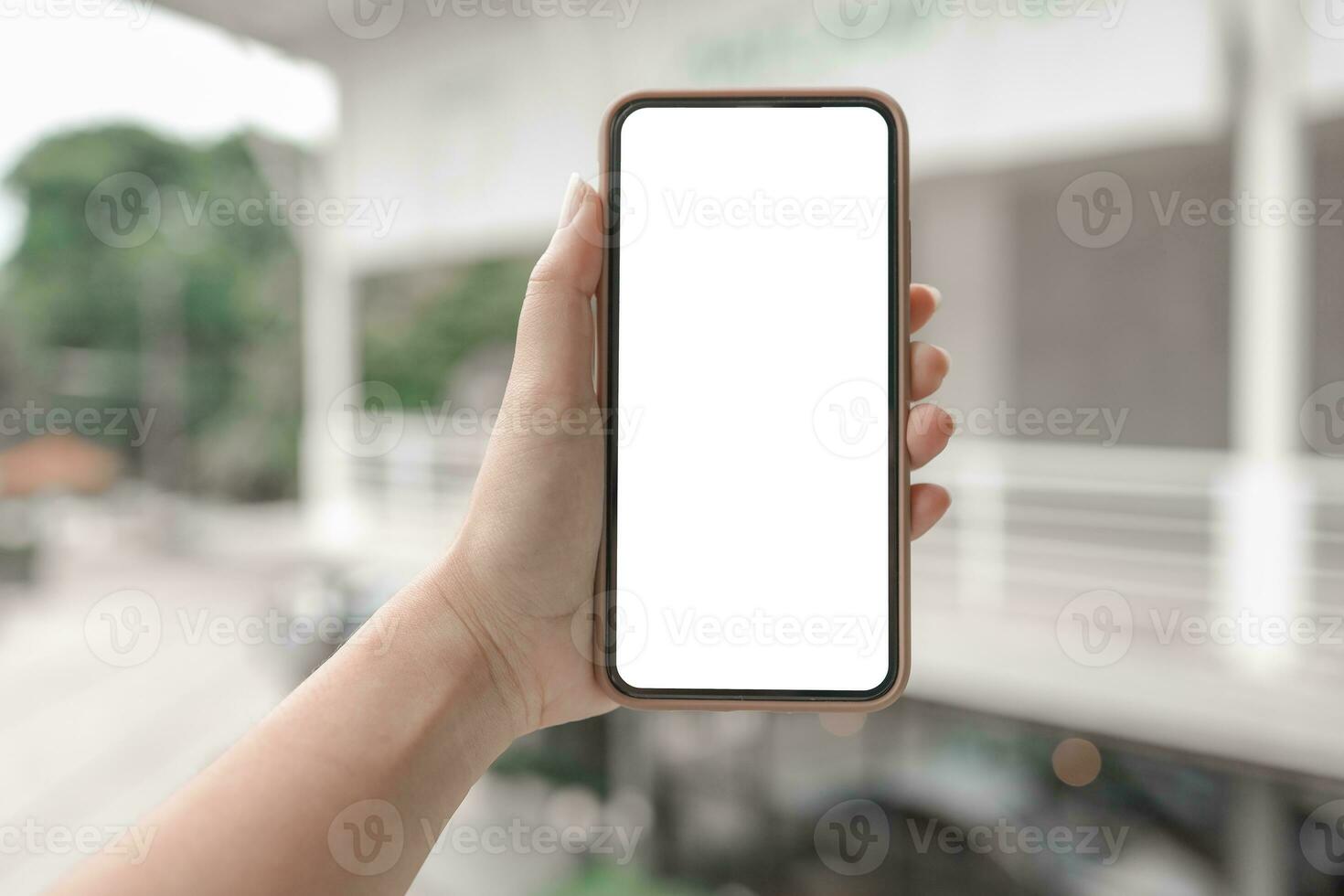 Women's hands holding cell telephone blank copy space screen. smart phone with technology concept photo