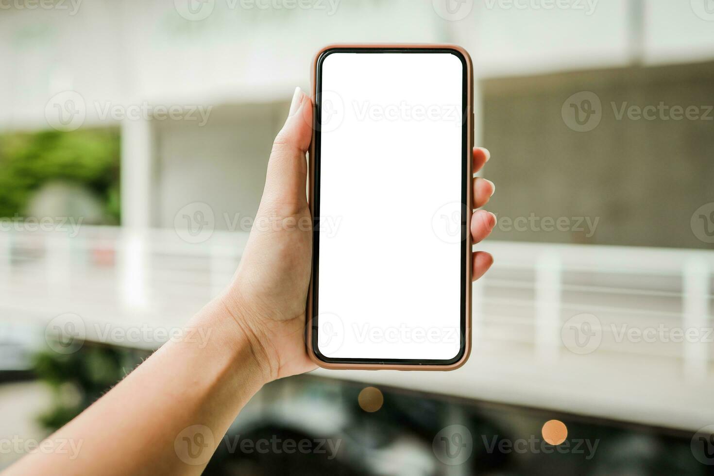 Women's hands holding cell telephone blank copy space screen. smart phone with technology concept photo