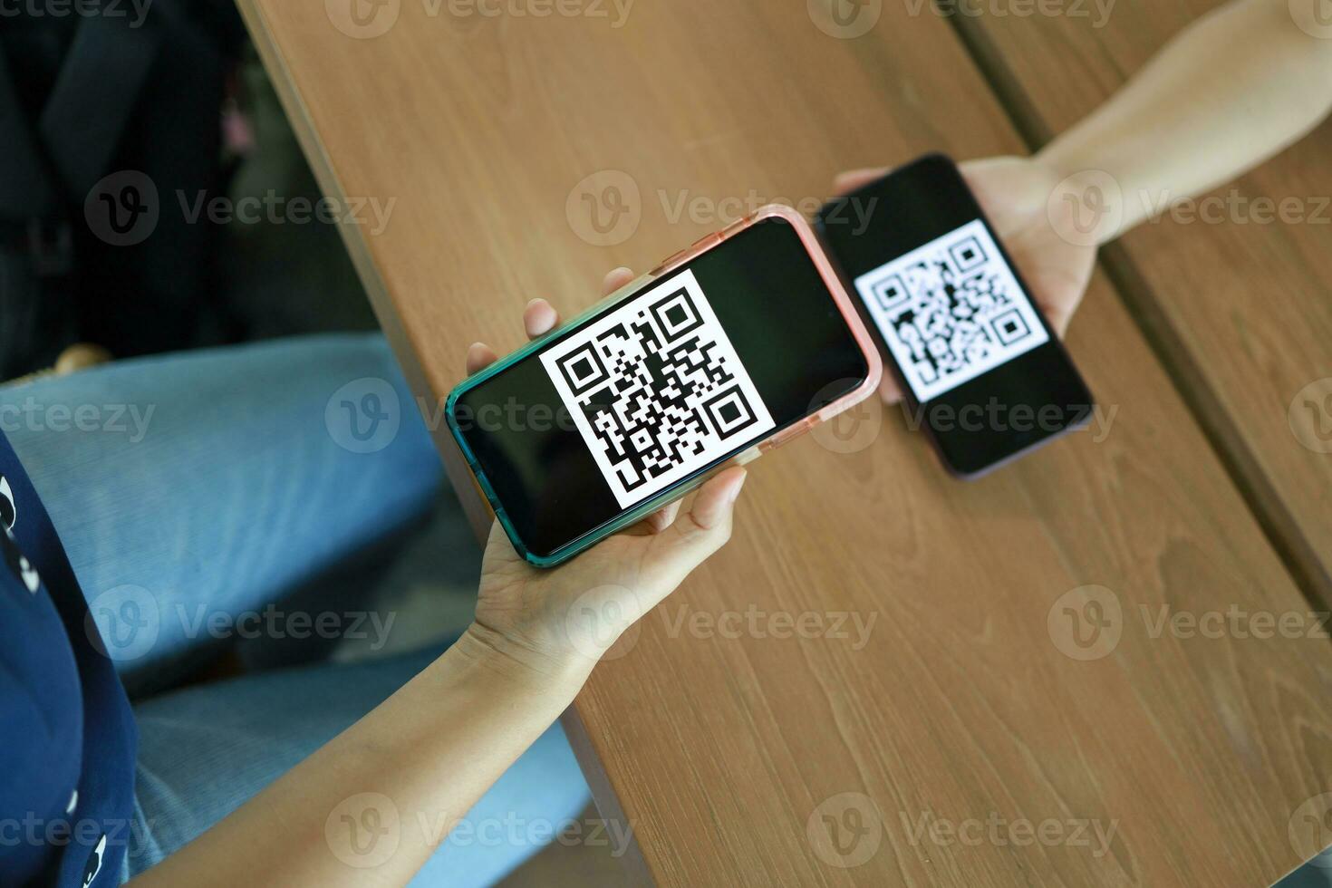 Qr code payment. Woman scanning QR code online shopping cashless technology concept. photo