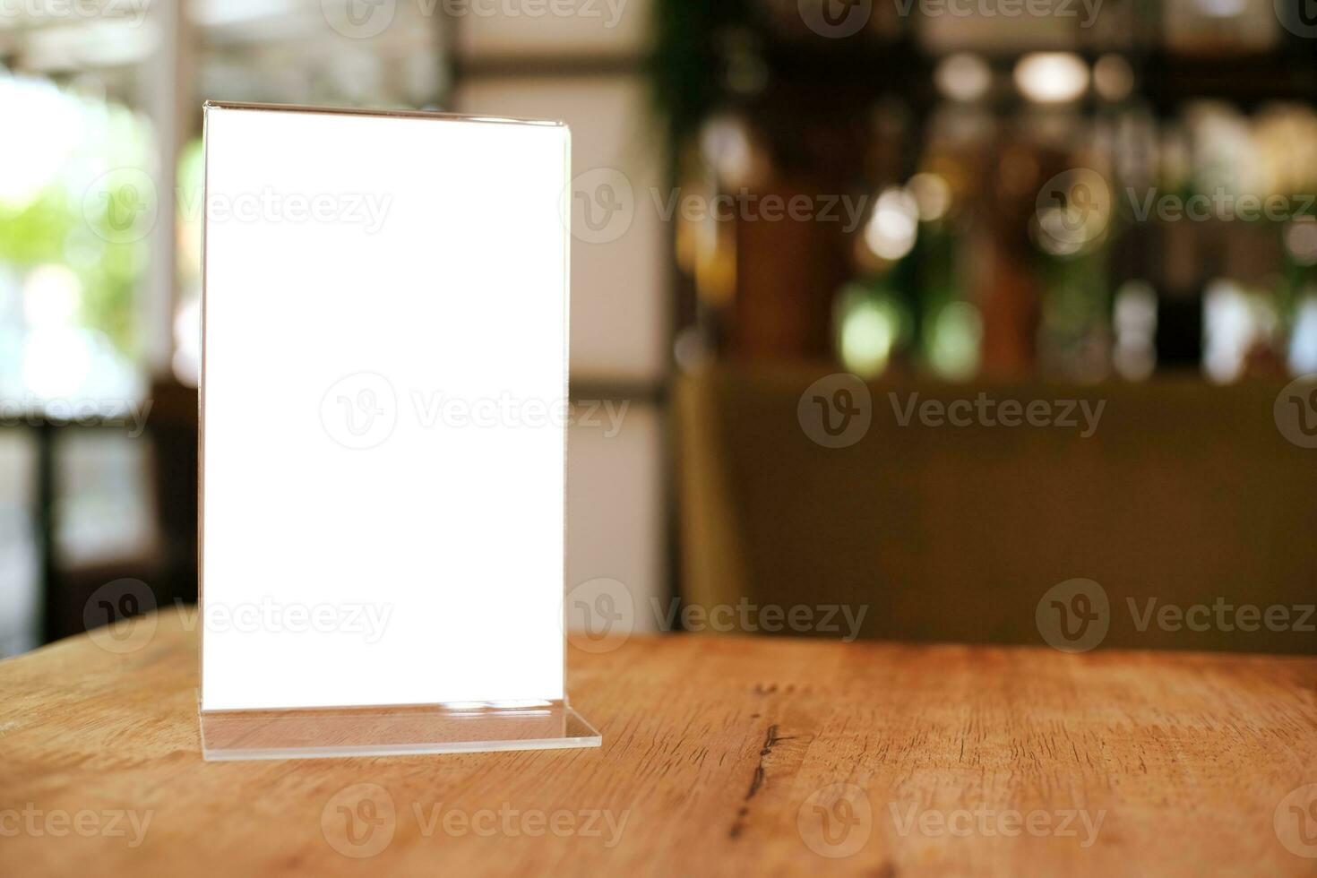 Menu frame standing on wood table in Bar restaurant cafe. space for text marketing promotion. photo