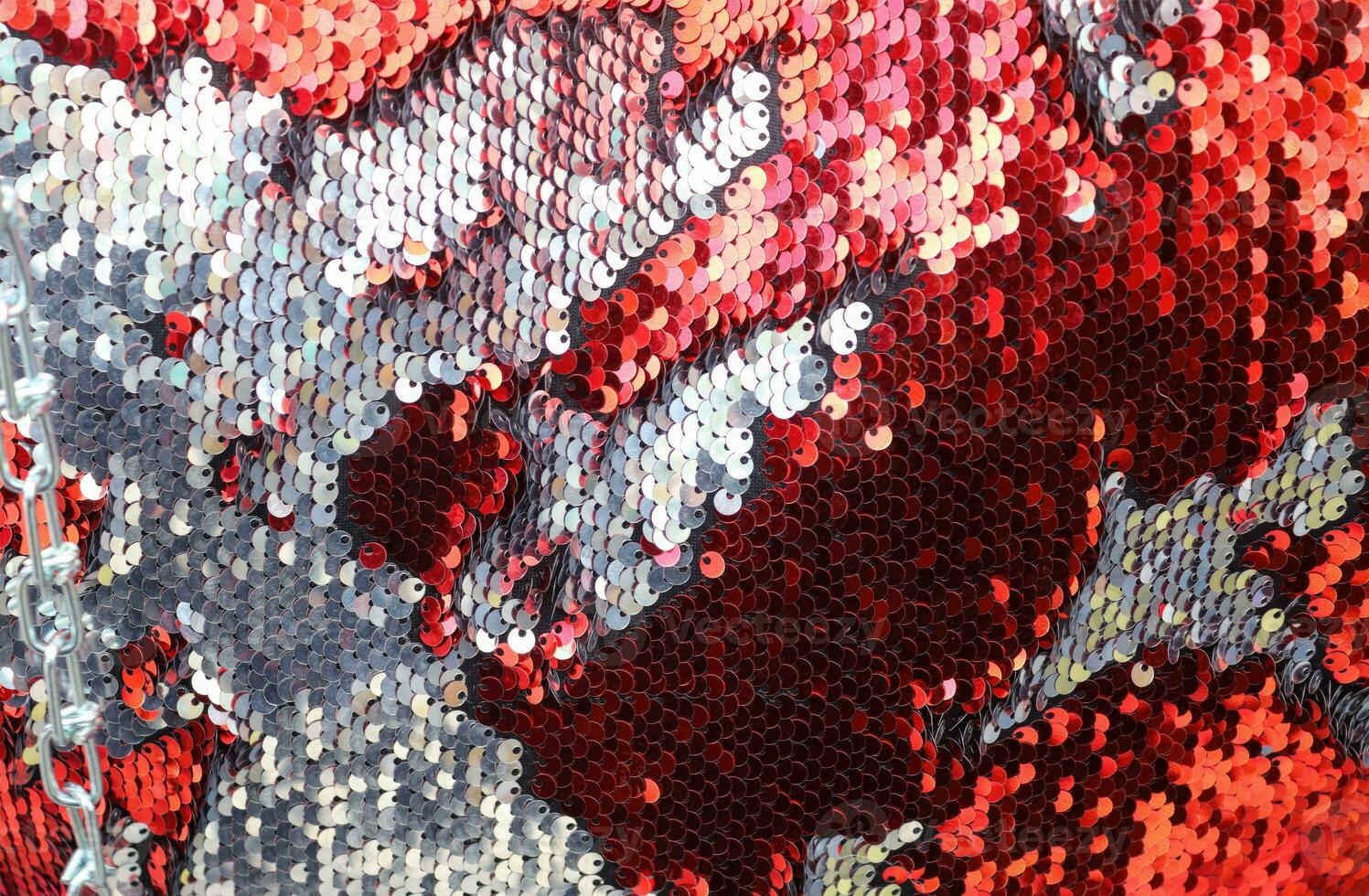 Detailed close up view on samples of cloth and fabrics in different colors found at a fabrics market photo