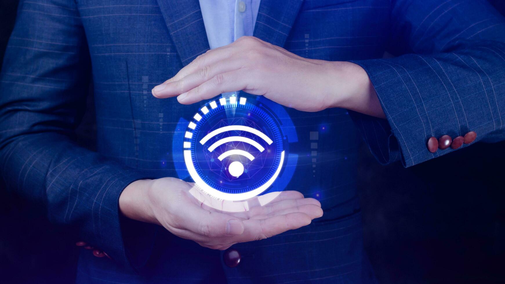 Businessman using holding with wifi icon. Social network business communication concept, Wifi wireless concept free network Internet concept. photo