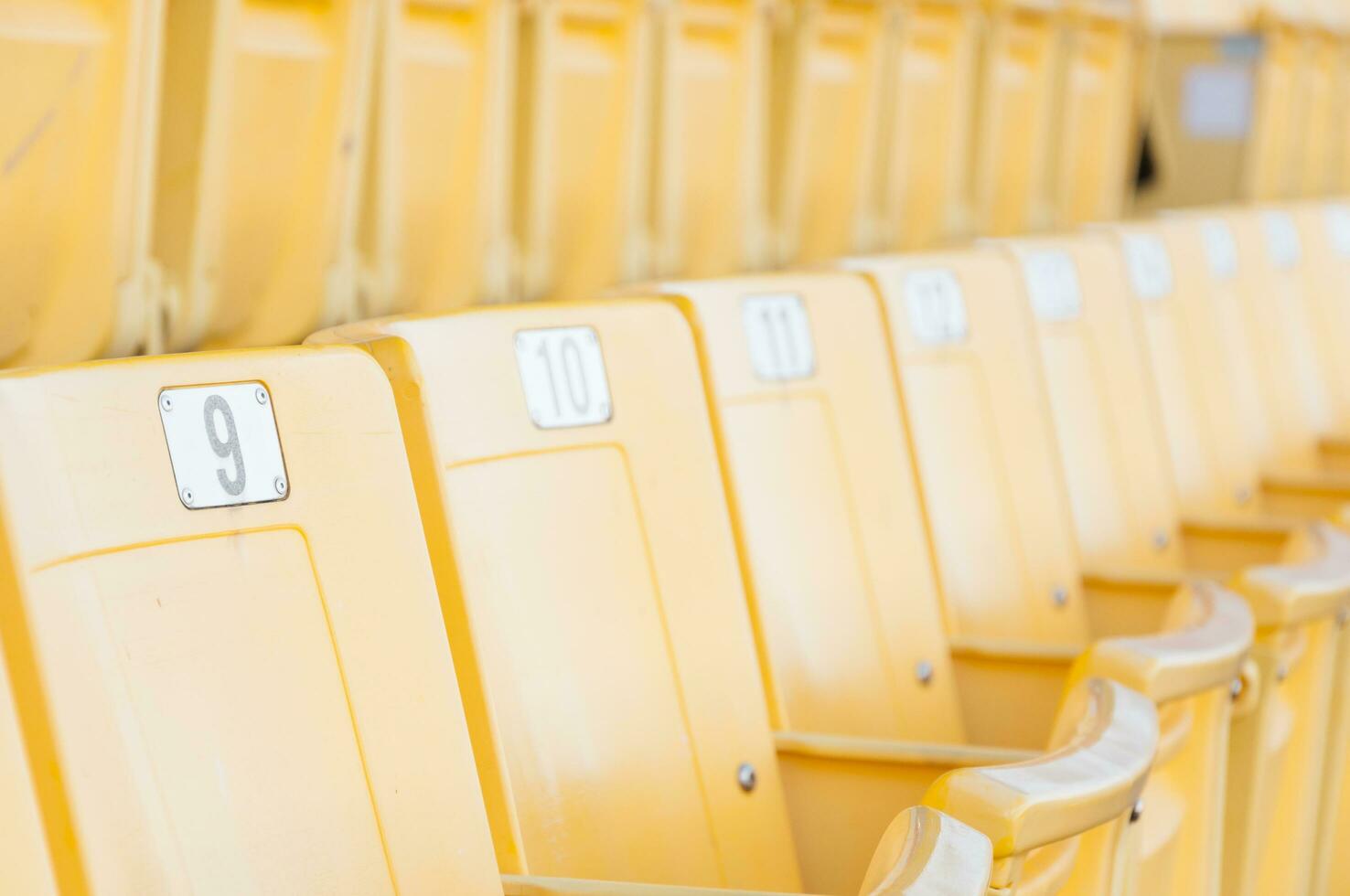 Empty yellow seats at stadium,Rows of seat on a soccer stadium,select focus photo
