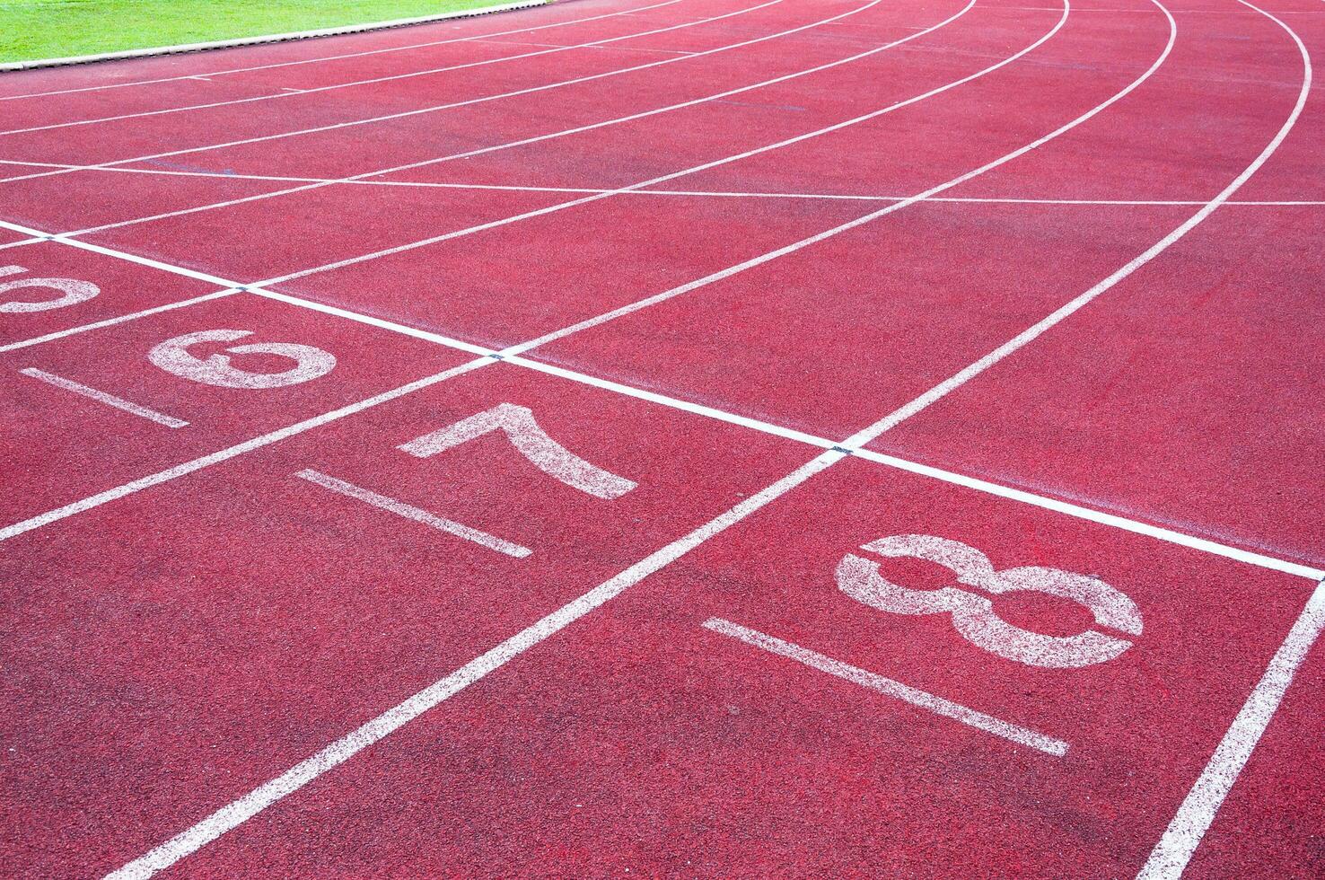 Numbers starting point on red running track,running track and green grass,Direct athletics Running track at Sport Stadium photo