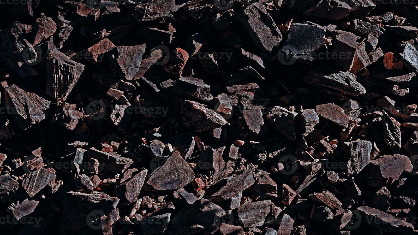 Stones rocks spiky close up structure illuminated by the sun, rock texture for background. Top view photo