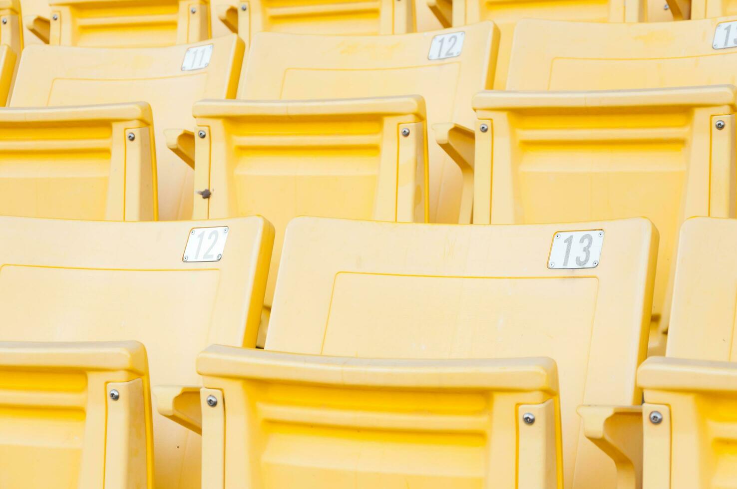 Empty yellow seats at stadium,Rows of seat on a soccer stadium,select focus photo