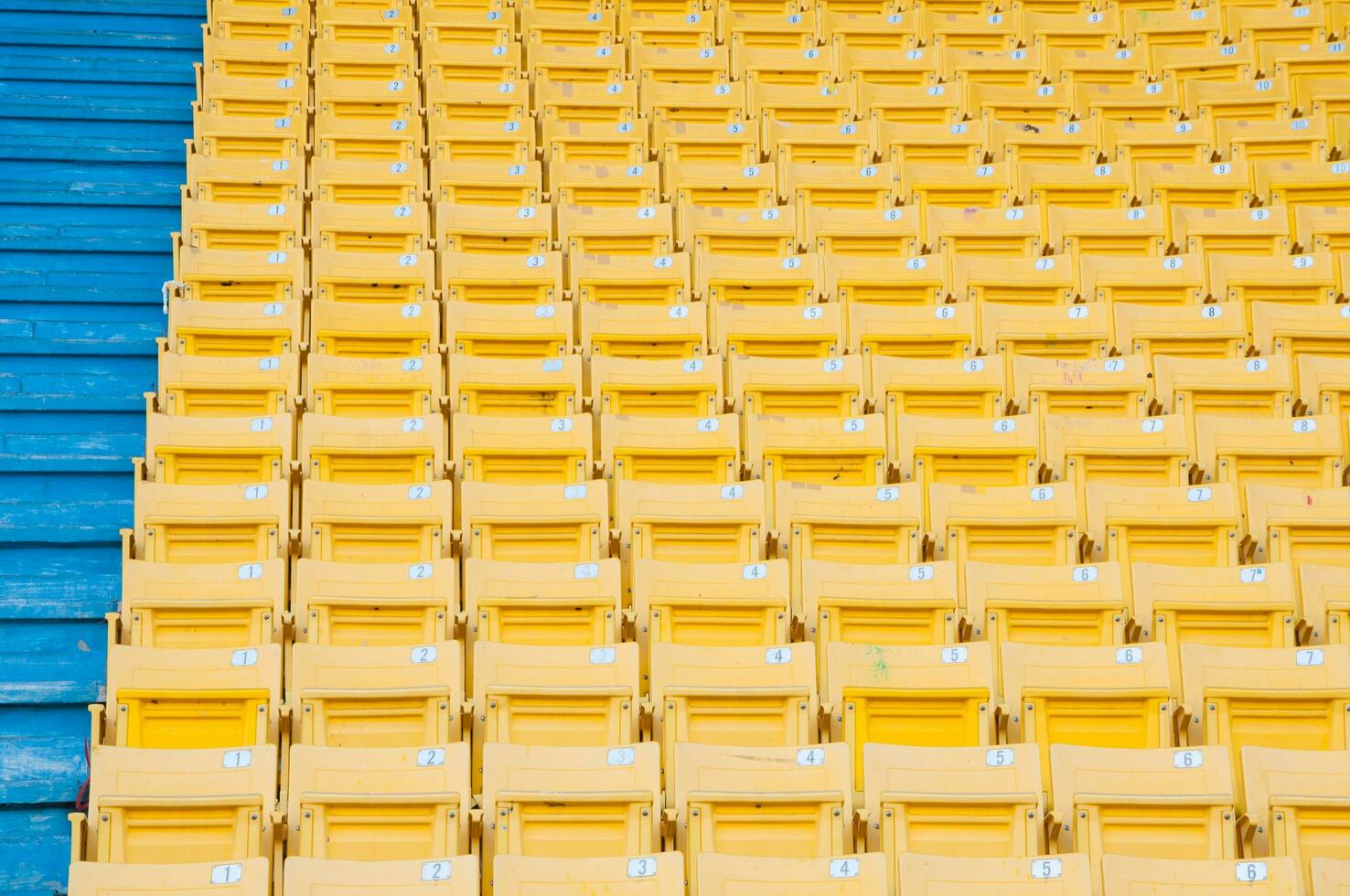 Empty yellow seats at stadium,Rows of seat on a soccer stadium,select focus photo