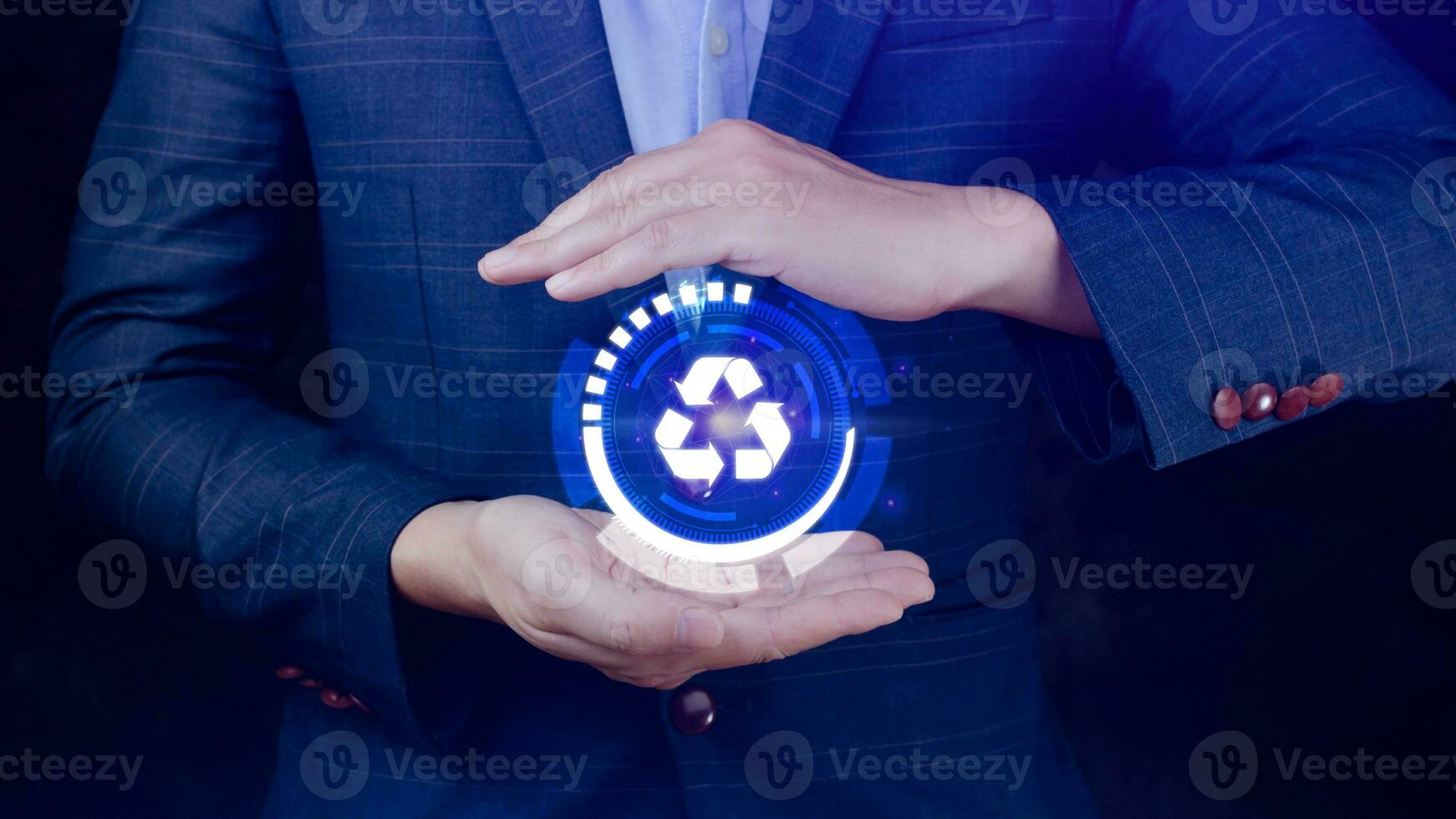 Businessman hand holding recycle icon concept in screen, for environmental, social and governance in sustainable and ethical business on the Network connection. photo