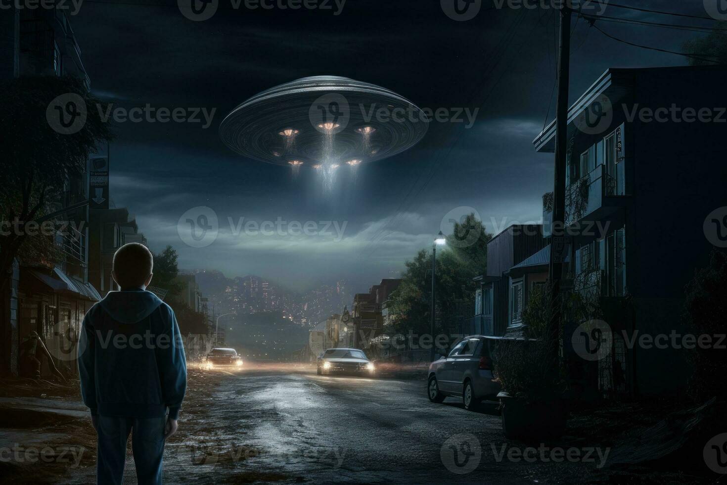 A street at night with an alien flying over it photo