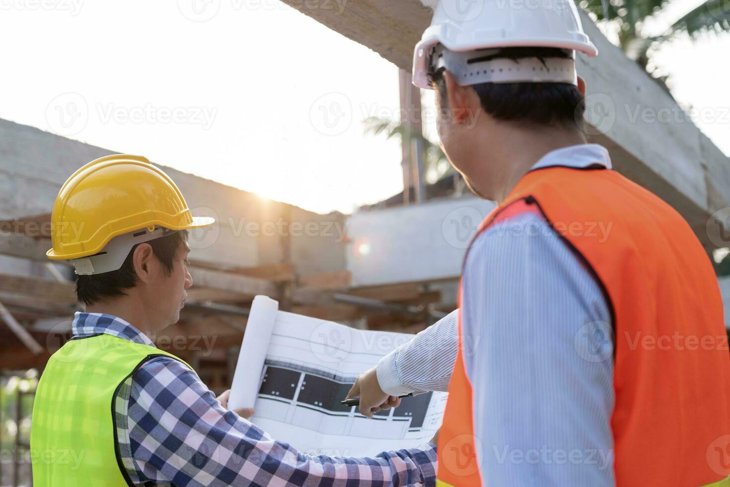Engineers team use laptop and check the blueprint on site. Contractor and inspector inspection construction during project.civil Forman check quality assurance. Audit, inspect, quality control. photo