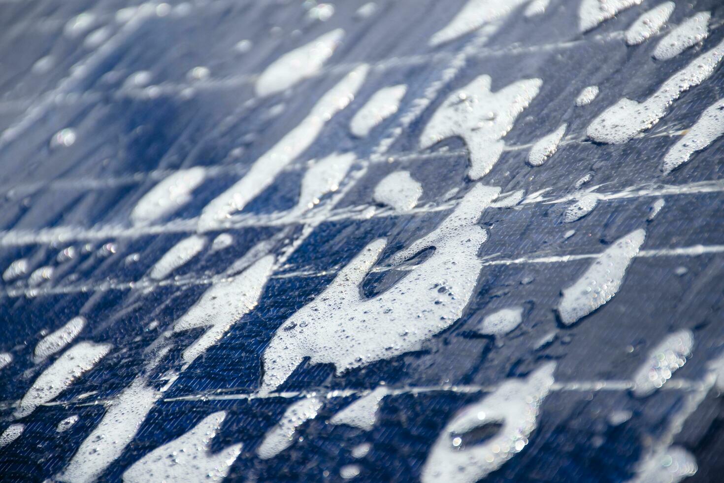 Front and upper surface of photovoltaic or solar cell panel which washing by water and soap to save and use it for a long time, soft and selective focus. photo