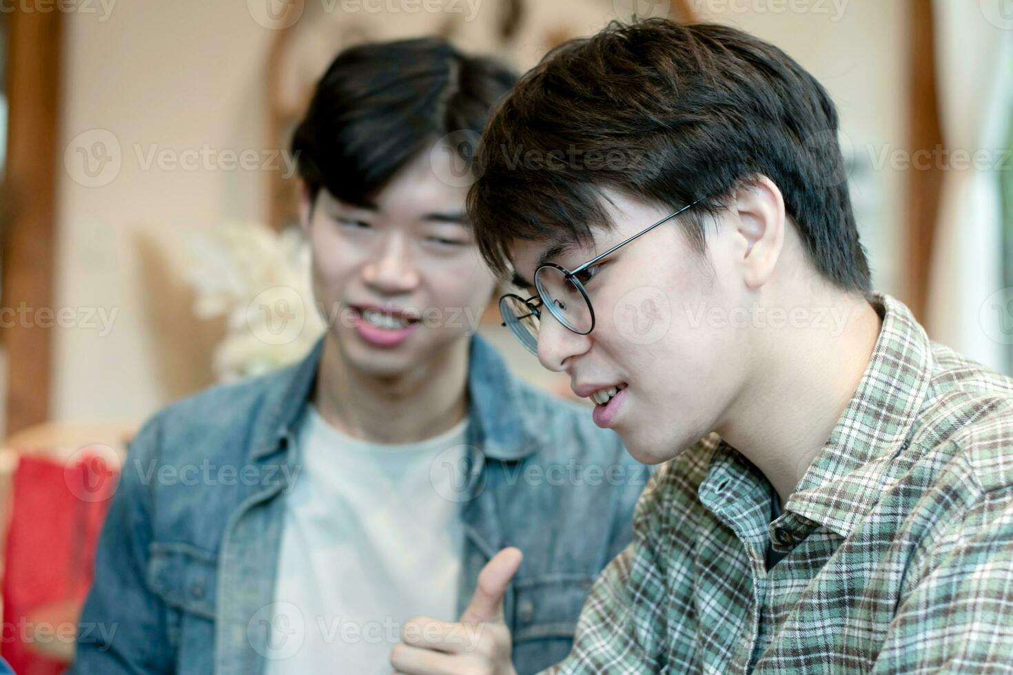 asian young adult couple spending their free times by talking and consulting their daily life problems in coffee shop, happy life, gender diversity and teenagers lifestyle concept. photo