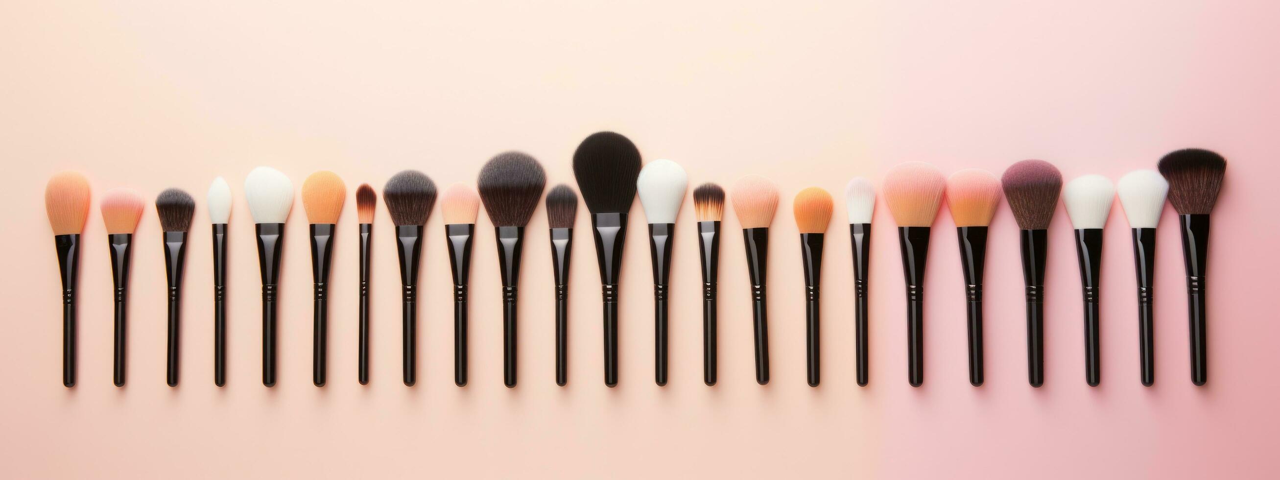 Collection of makeup brushes lined up in a row photo