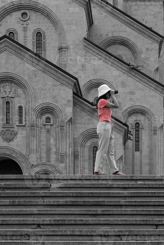 Photographer Taking Picture of Holy Trinity Cathedral of Tbilisi Geougia. Fade Color photo