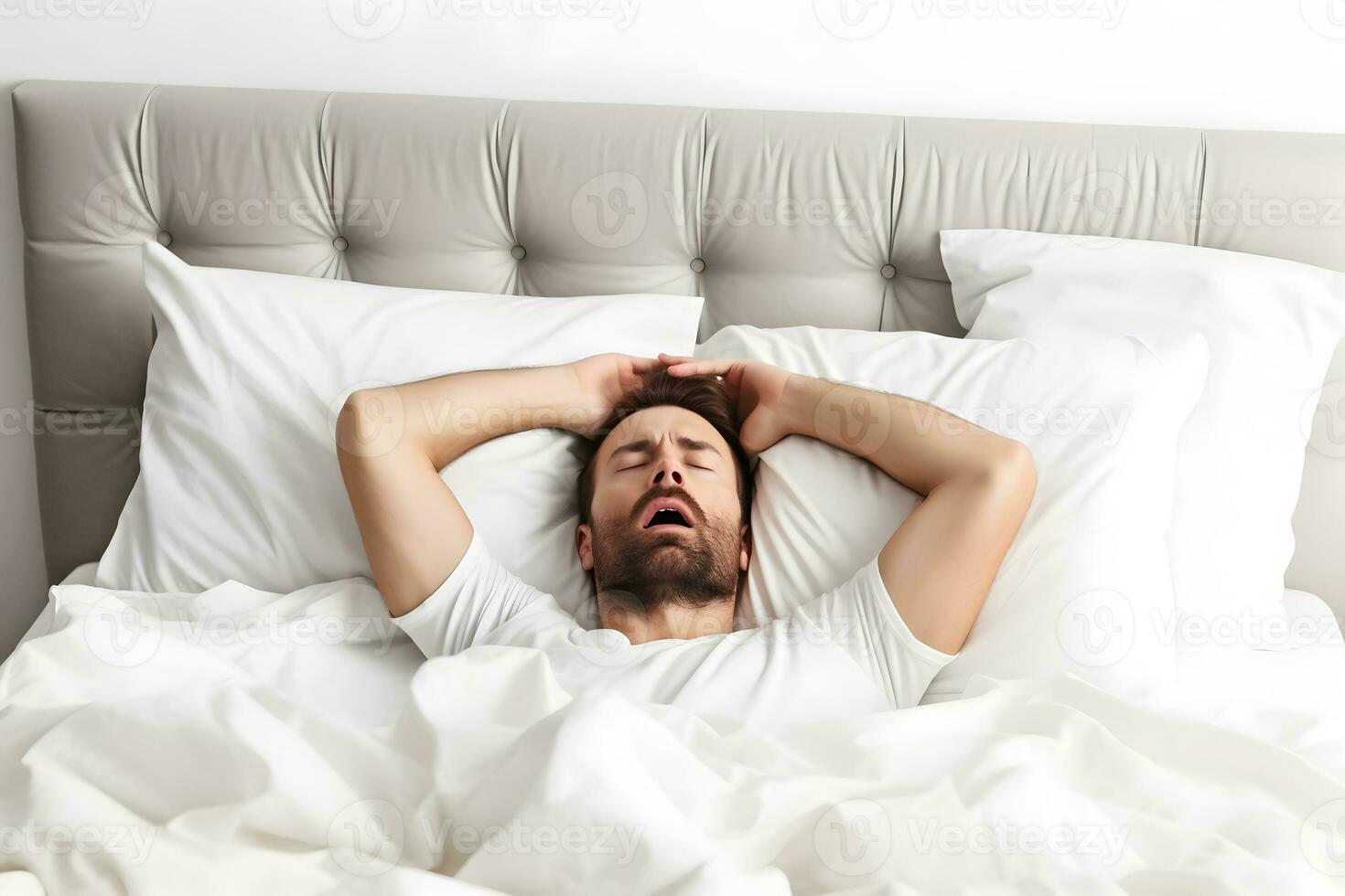 Man on bed, suffering hangover after drinking alcohol. AI generated. photo