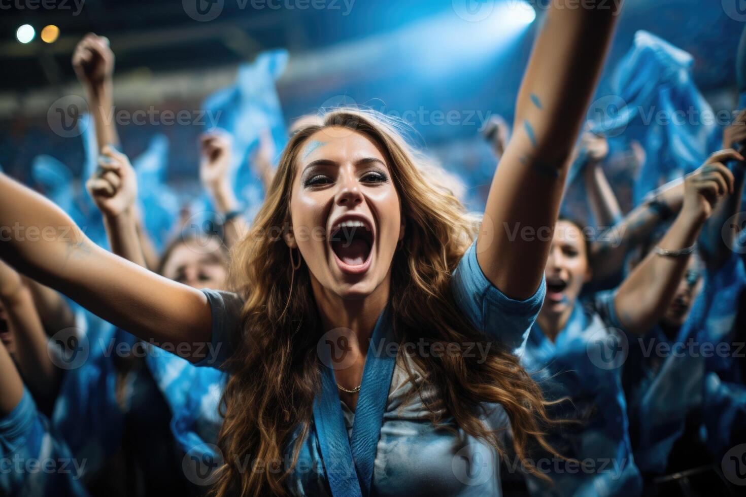 a woman in a crowded stadium surrounded by cheering fans photo