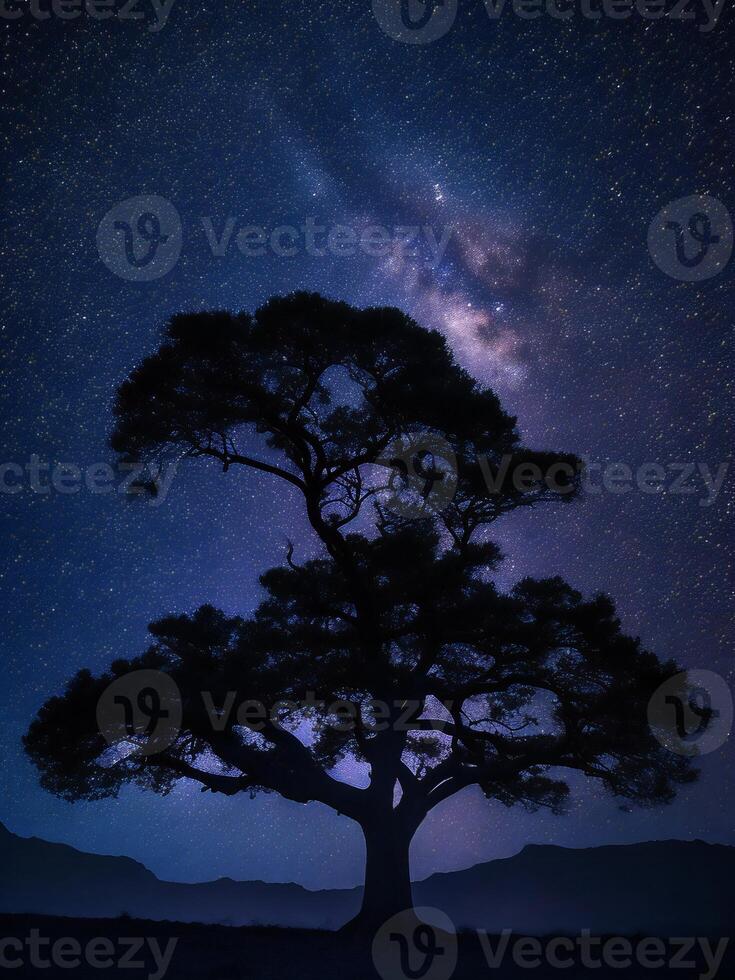 a majestic tree silhouetted against a backdrop of the vast night sky filled with stars ai generated photo