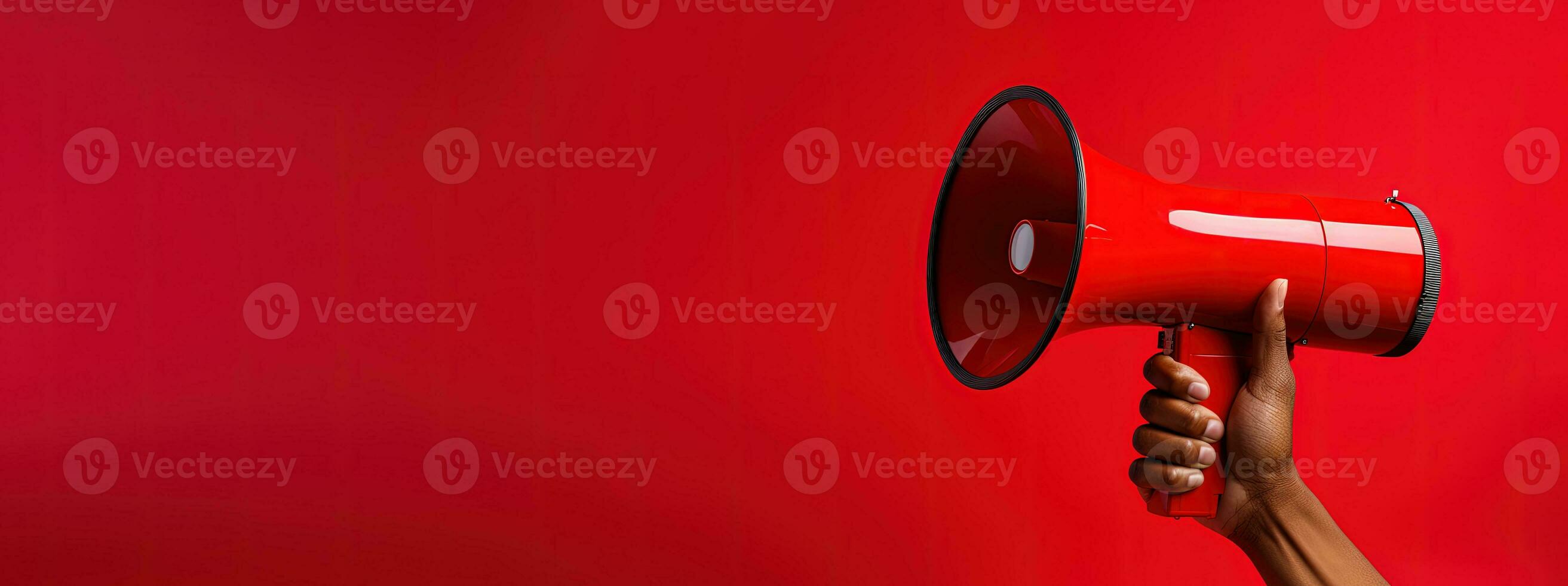 Generative AI, megaphone in hand on a empty red background, panoramic image with copy space photo