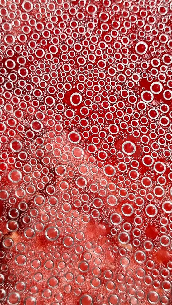 abstract drops on the surface of transparent plastic. Smooth small bubbles in the shape of a regular circle, abstract background of water bubbles photo