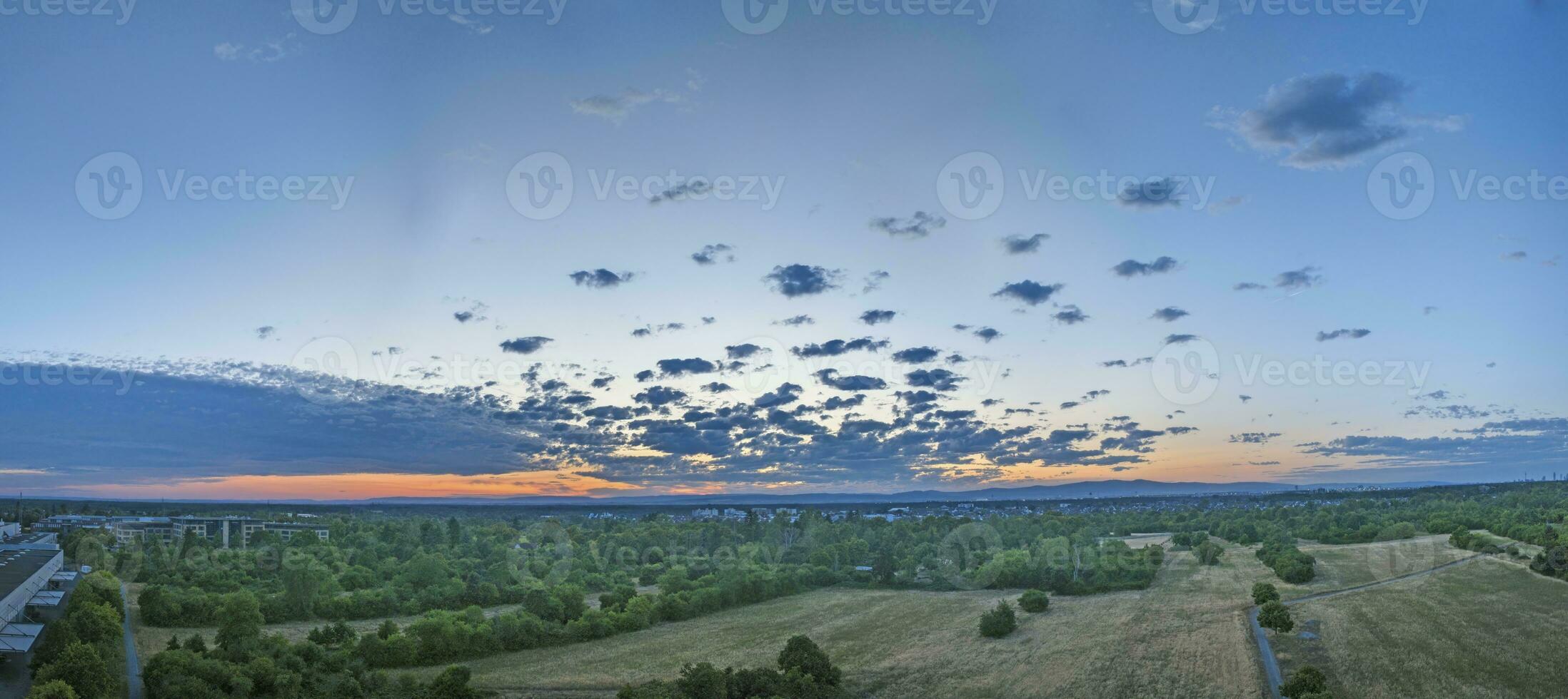 Panoramic image of beautiful cloud formations during sunset over Walldorf municipality photo