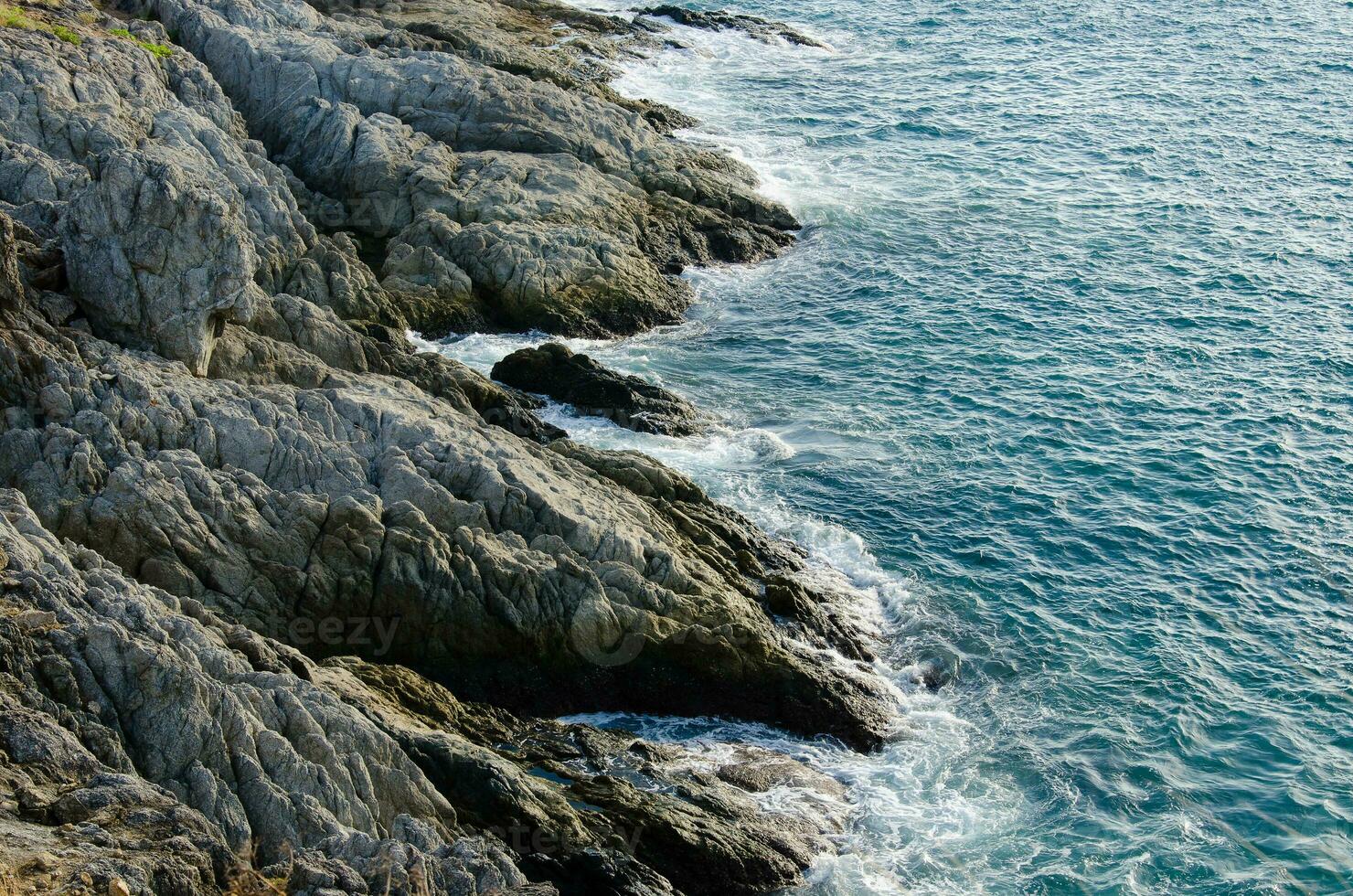Sea Wave Attacked the Rocks at Phromthep Cape of Phuket Province of Thailand photo
