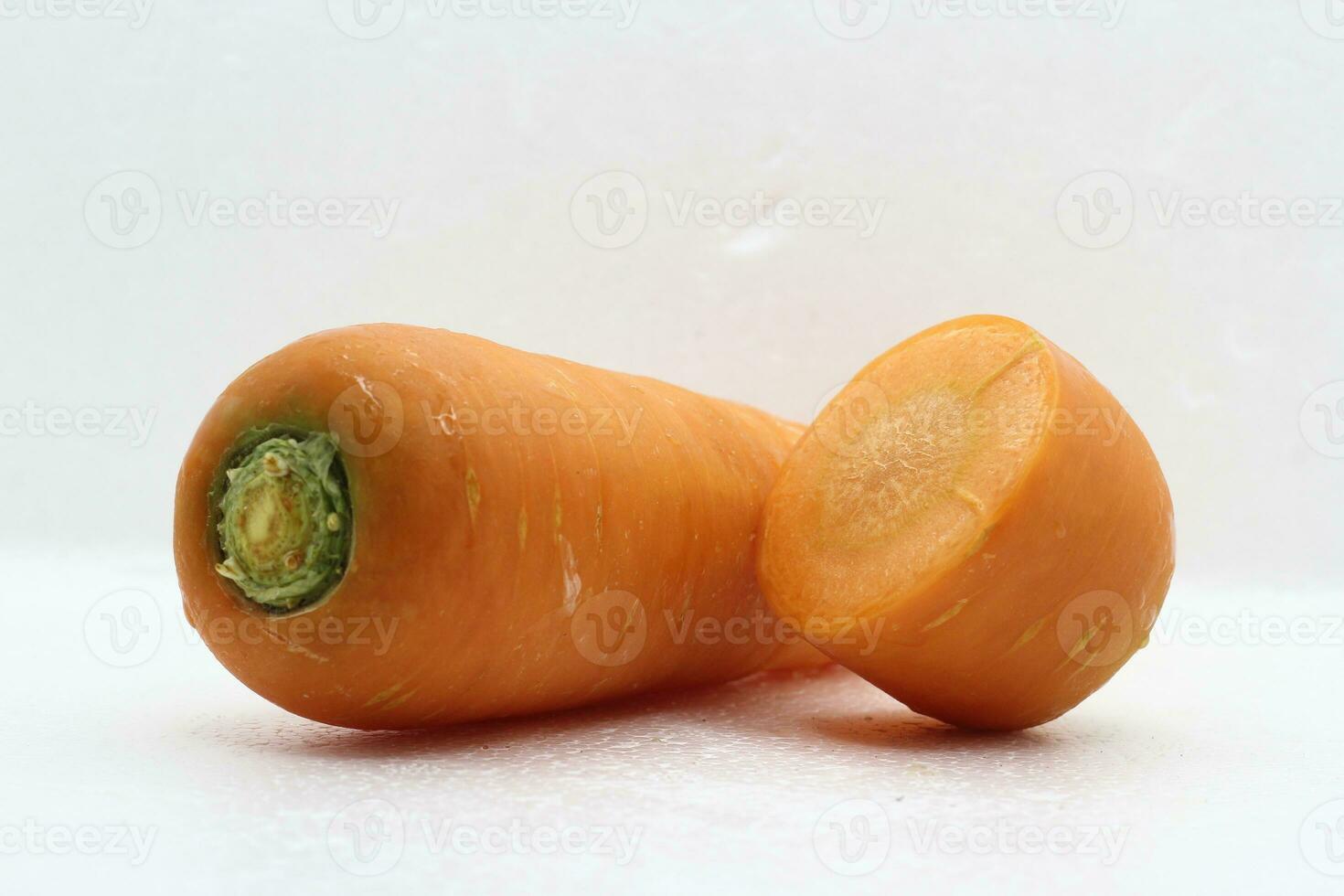 Fresh vegetable carrots on white background cut into slices. photo