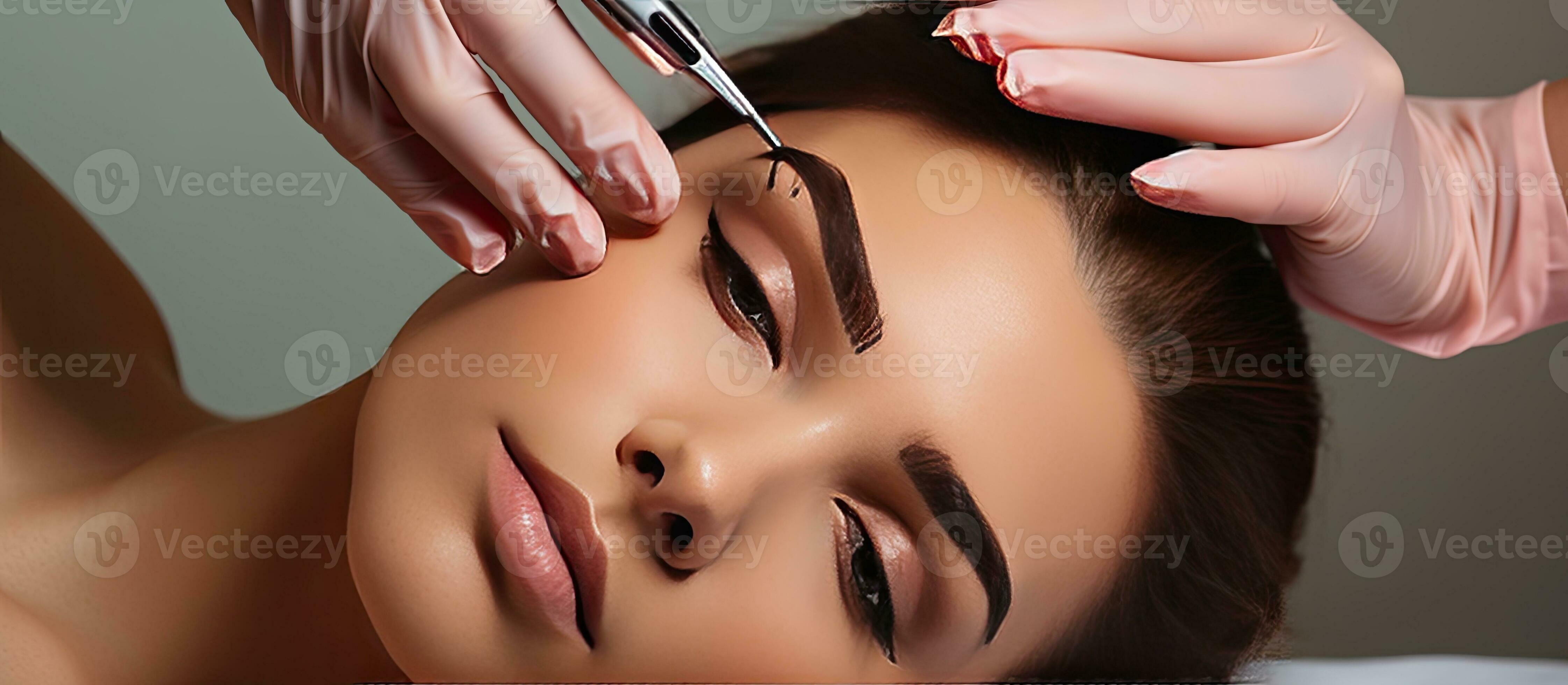 Cosmetologist measures eyebrow proportions with ruler during