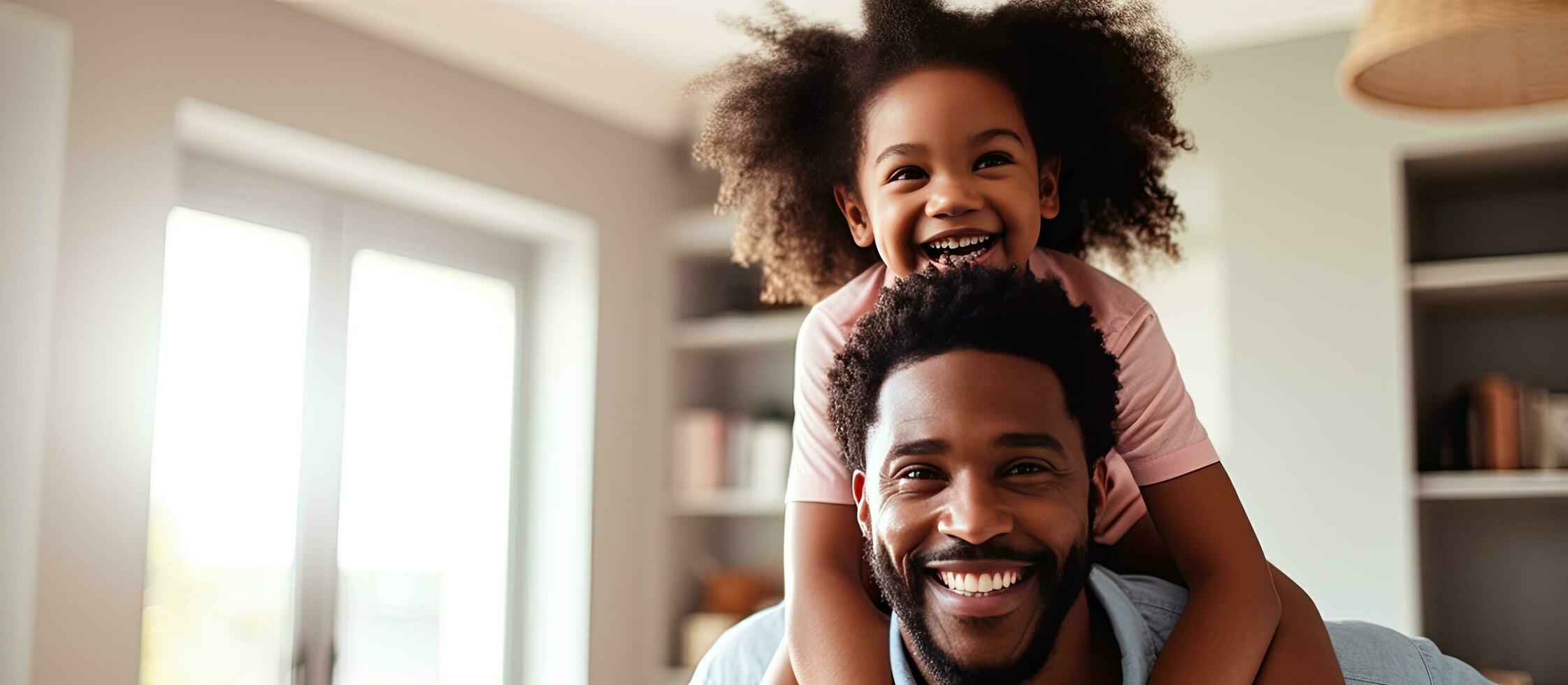 Happy African American father and daughter playing father carrying little girl Joyful family bonding Father s Day concept banner with copy space photo