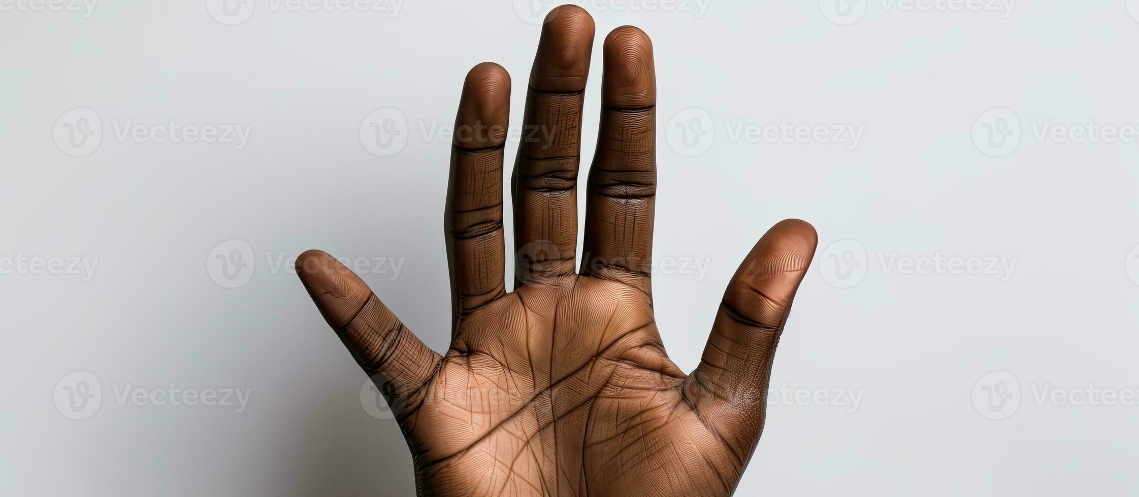 Hand of mixed race person holding black business card on white background photo