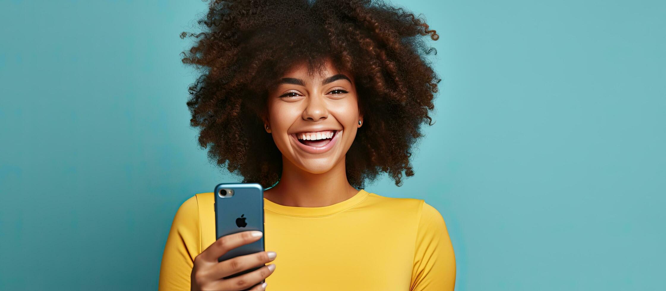 Blue shirted woman with afro hair takes selfies and video calls for freelance work on social media using a phone photo